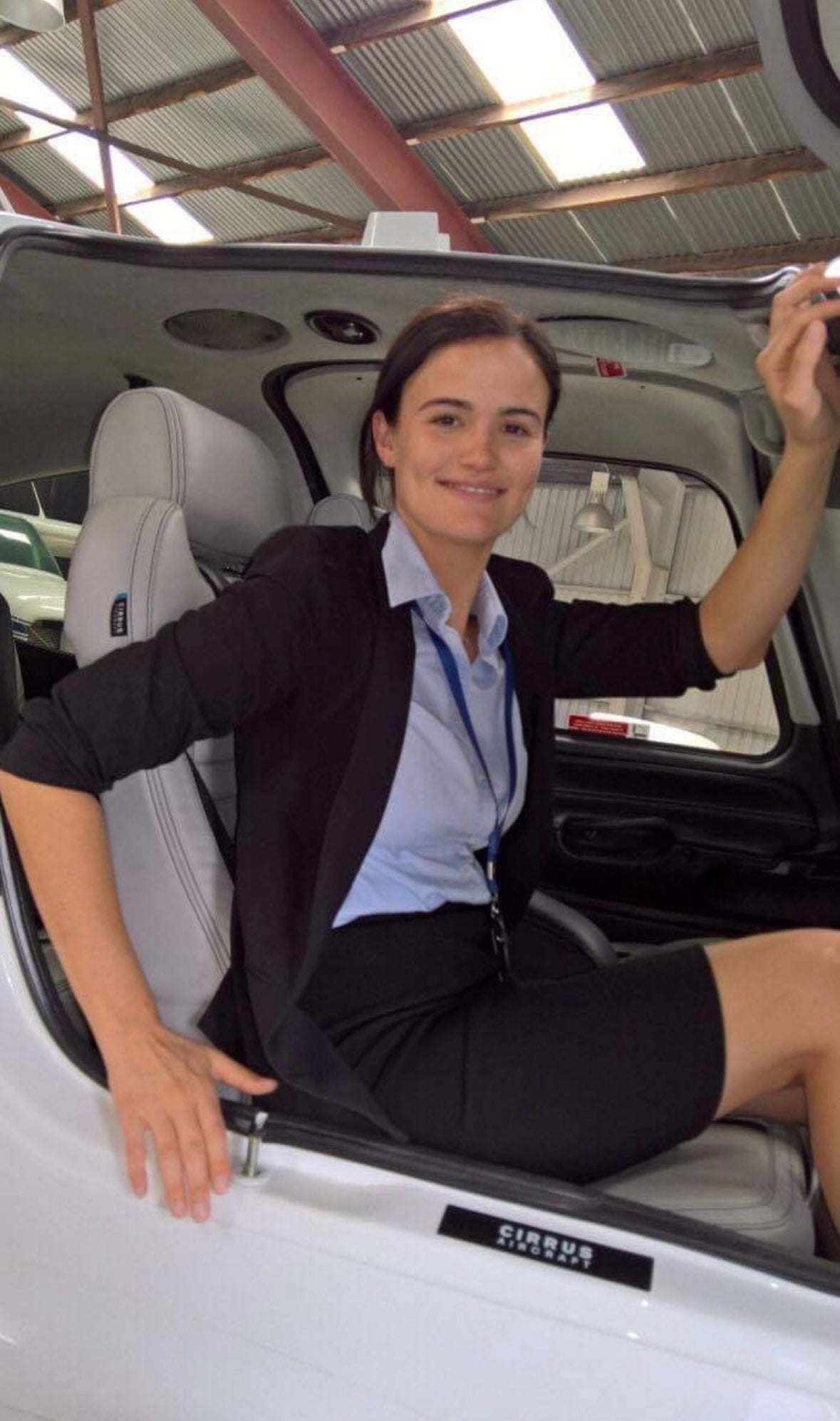 Photo of jewellery designer Cassandra Djodan in her previous aviation career, seated inside a small aircraft, representing her journey before building her jewellery business.