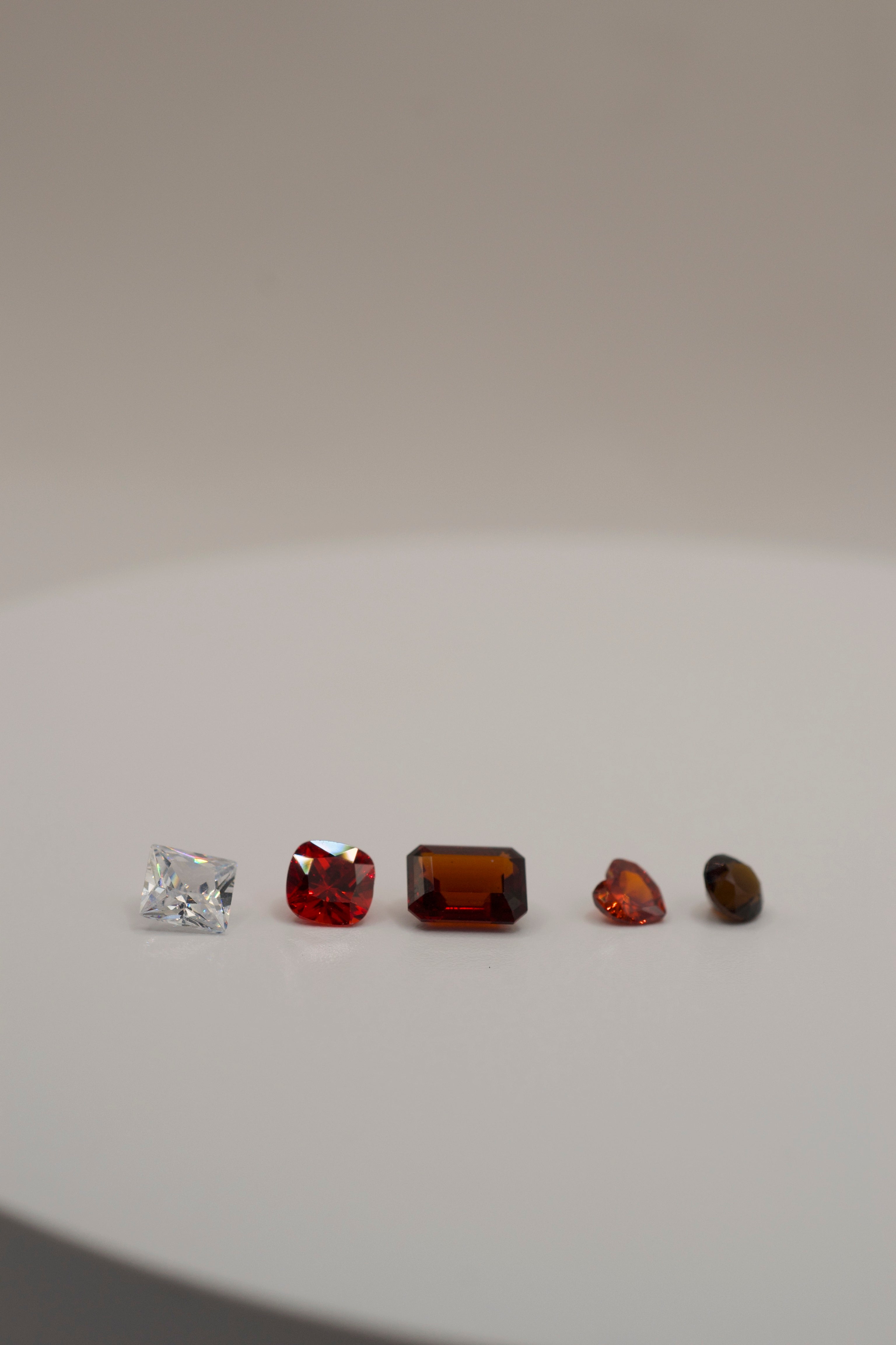 Selection of gemstones for wax carving and silver or gold casting in place.