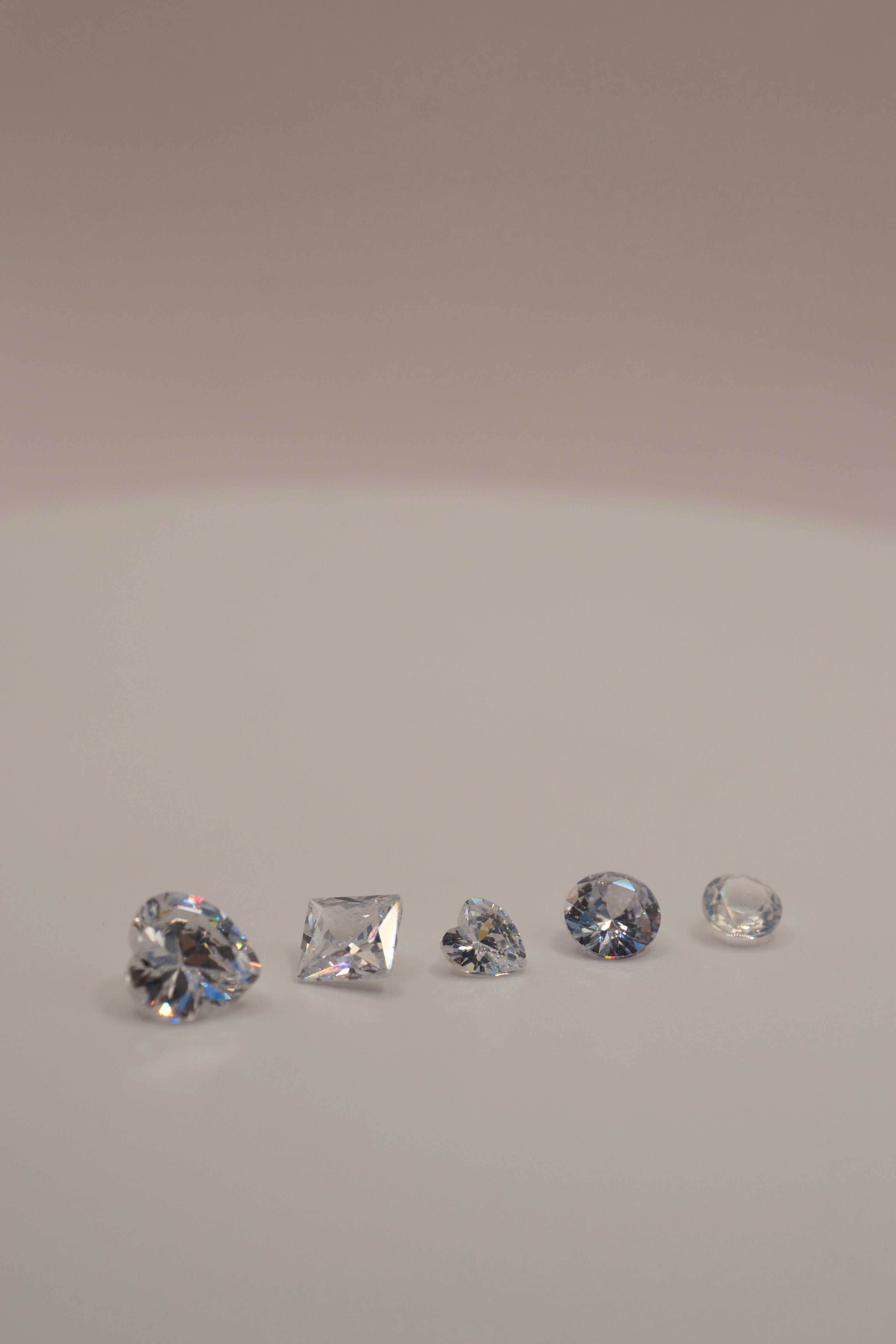 gemstones for lost wax casting, cast in place jewellery stones, cubic zirconia gemstones, nano opal gem, lab grown sapphire round cut, heart cz gemstone, princess cut cz, white gemstones for rings, heat resistant stones for casting, jewellery design gems.
