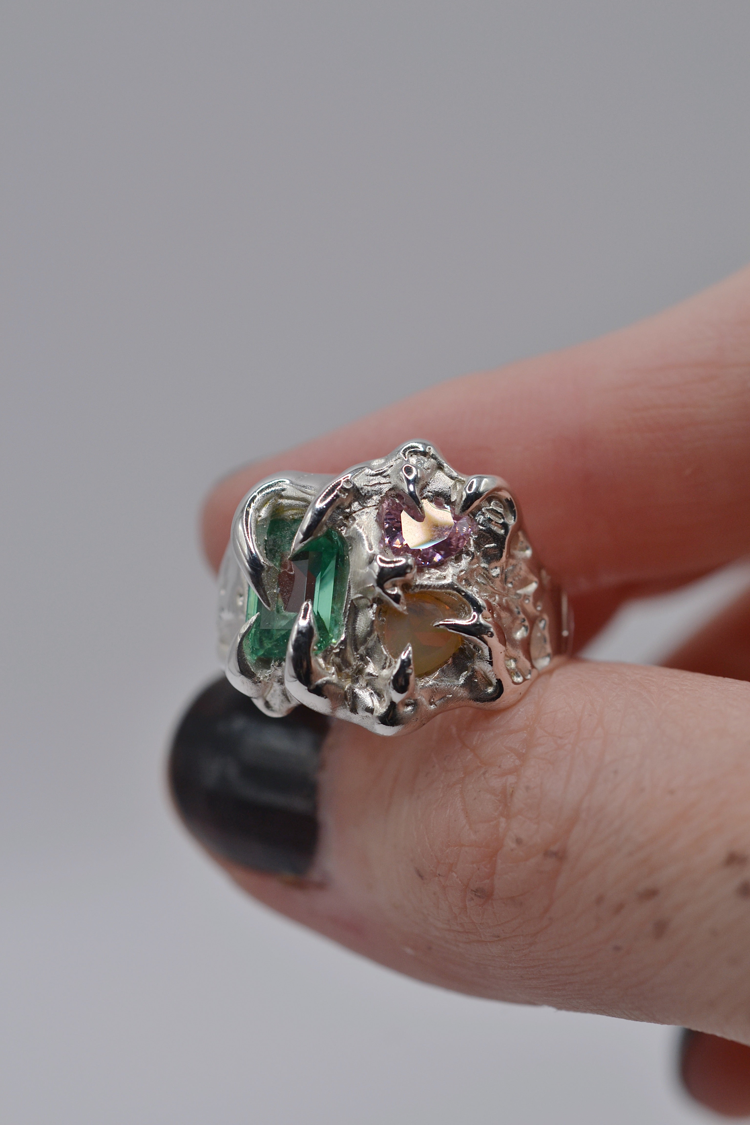 The Mirage ring worn from the side. Handmade organic silver, wax carved and lost wax cast. Unique alternative engagement ring. Metal Bones Jewellery.