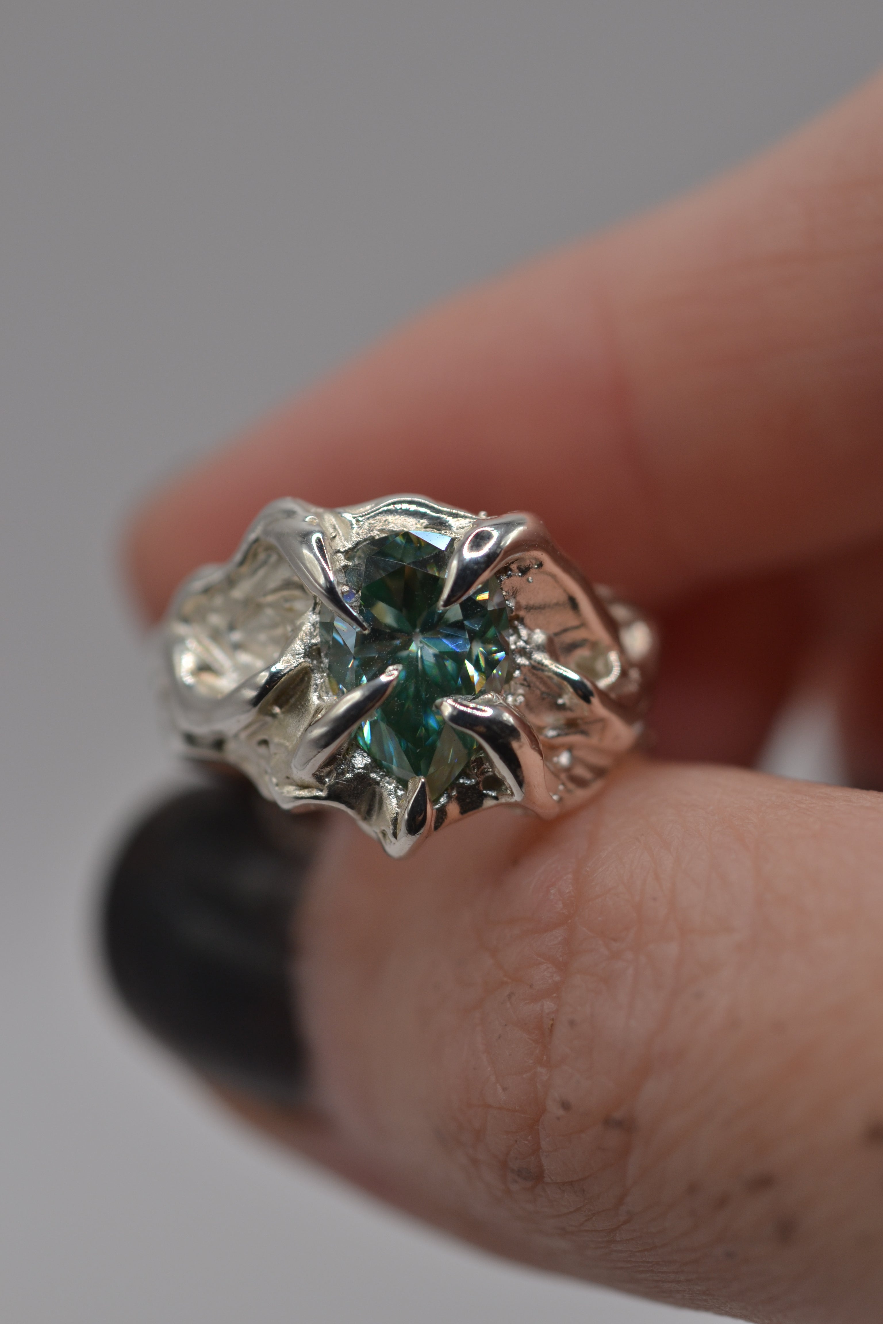 Close up of the Wrangler ring worn. Handmade organic silver, sculpted using wax carving and lost wax casting. One of a kind. Metal Bones Jewellery.