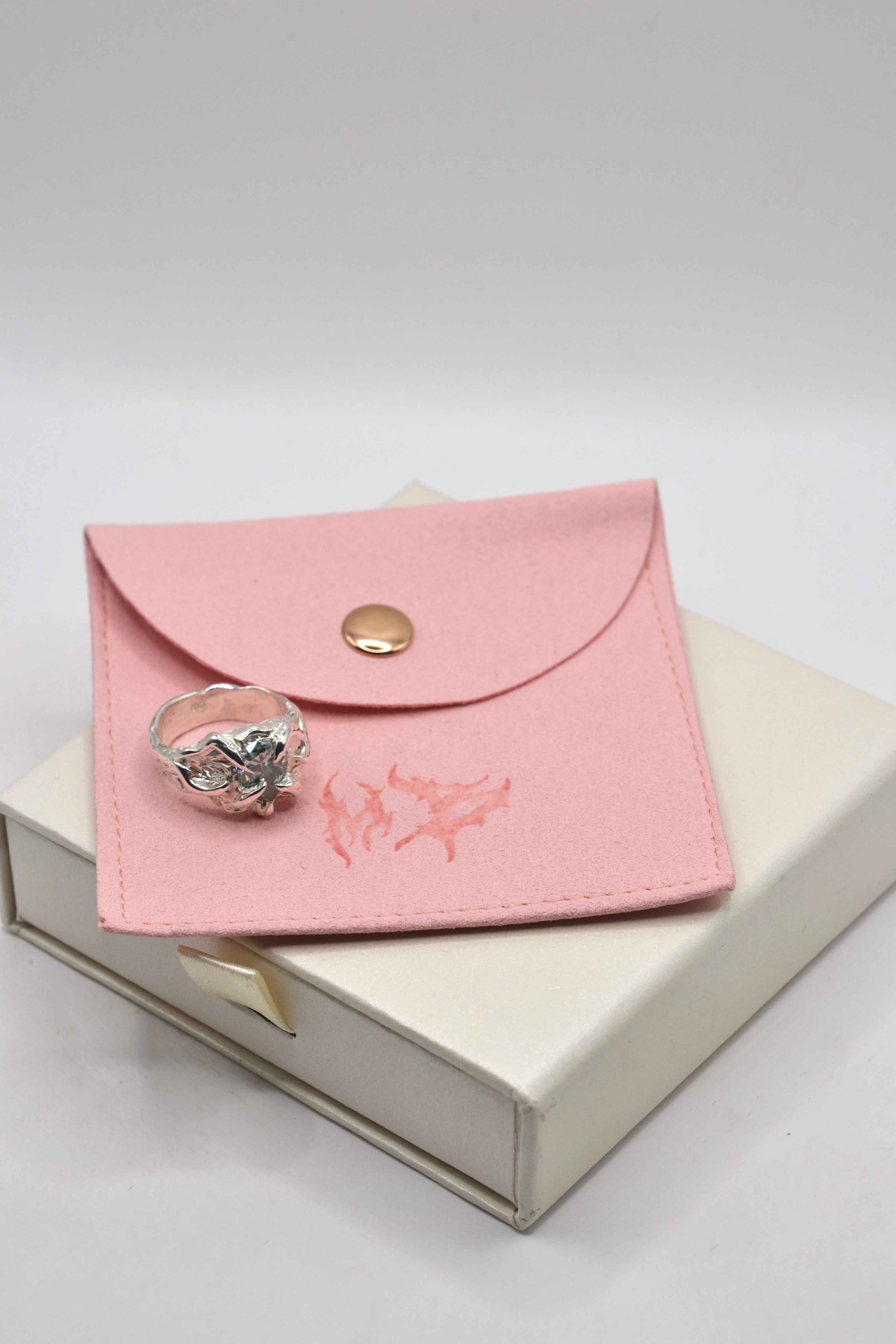 The Wrangler ring with gift packaging. Each ring is individually wax carved and lost wax cast in organic silver. Unique alternative jewellery. Metal Bones Jewellery.