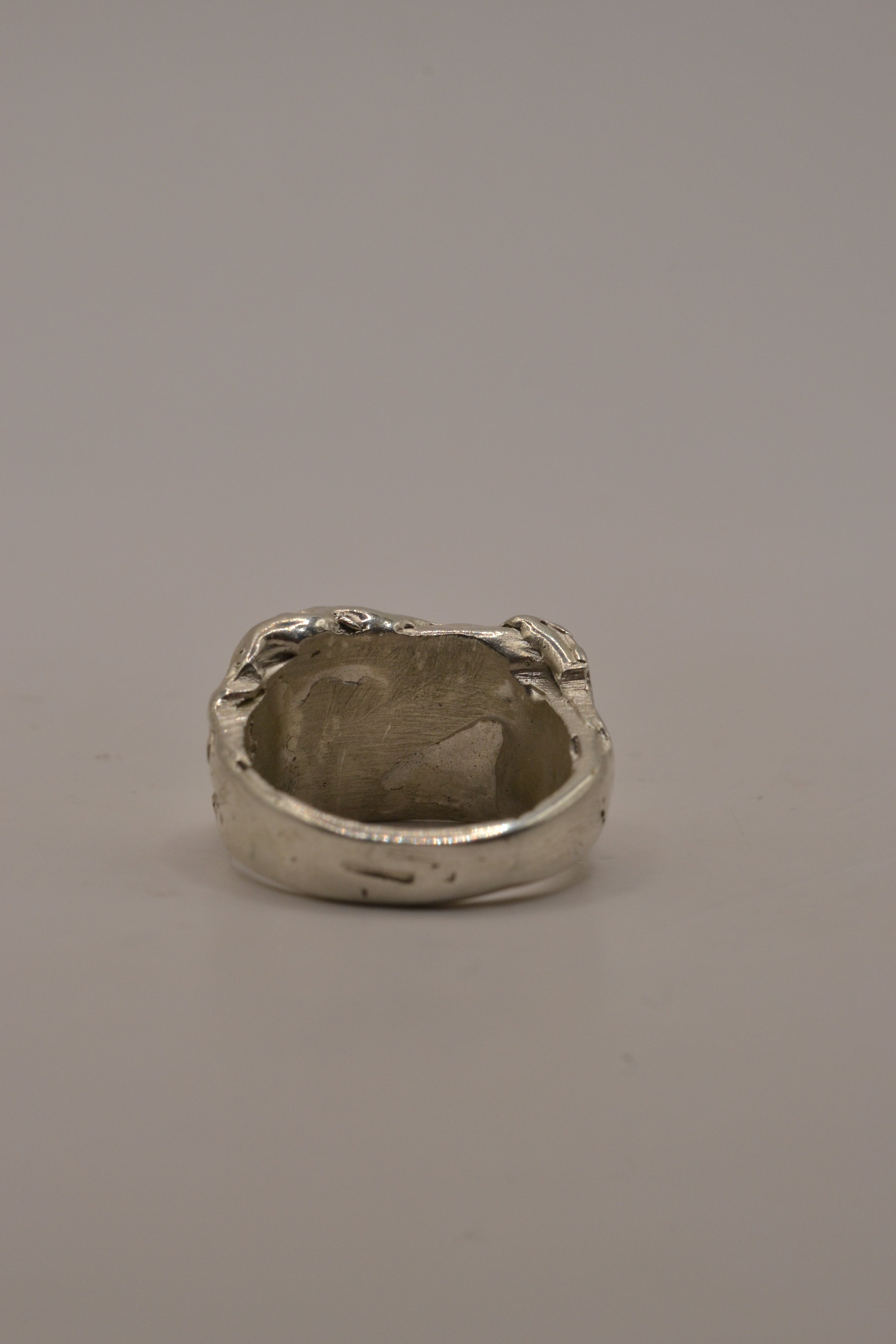 Another angle of the Concrete Ring showing raw concrete-like textured sterling silver signet face lost wax cast alternative jewellery
