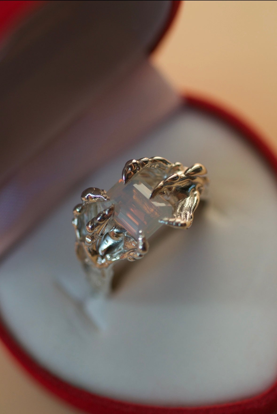 Sculptural lost wax cast silver Dragon Ring, handmade alternative jewellery made using the wax carving technique, available in a range of lab-grown crystal colours