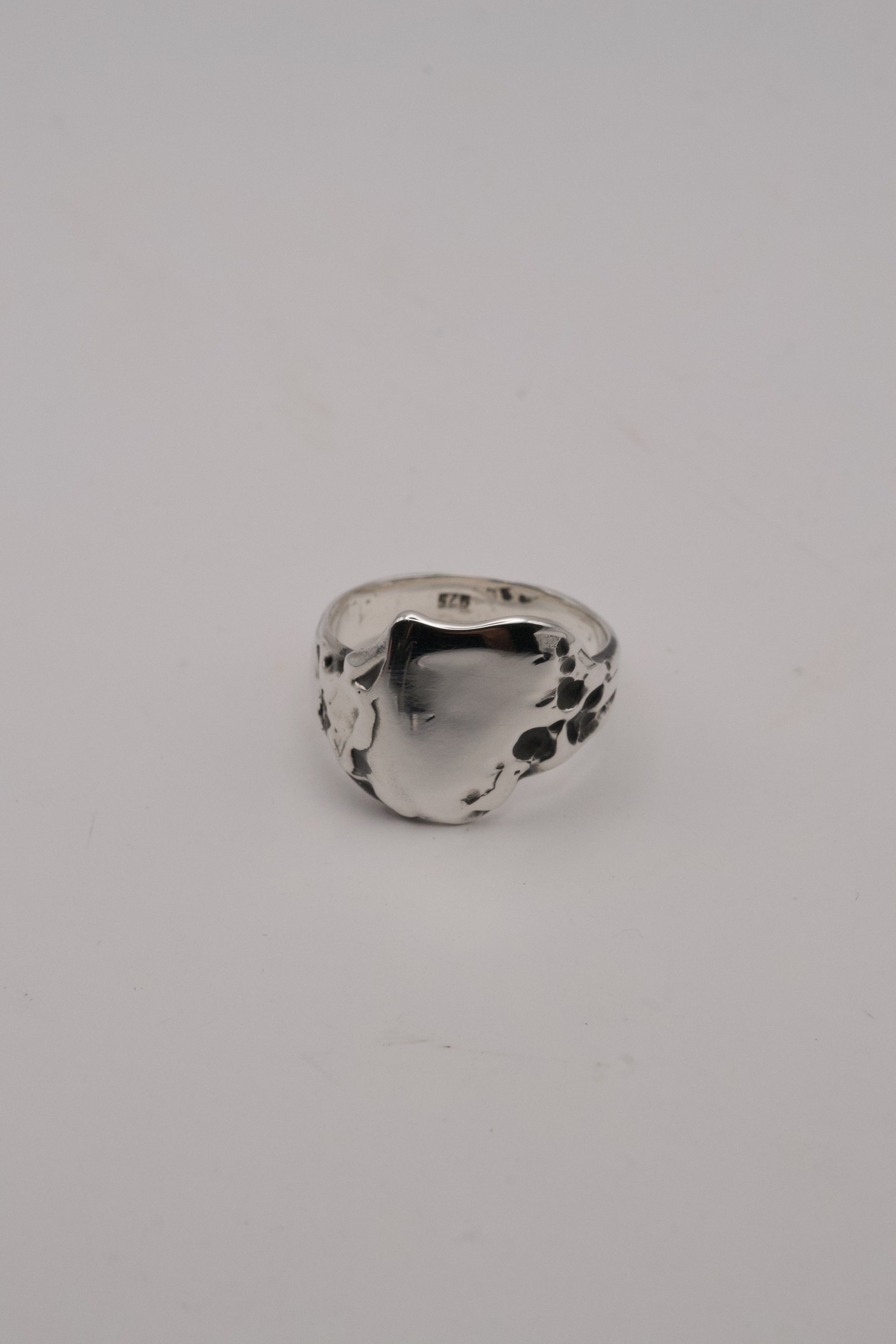 Handmade alternative silver signet ring Duality design lost wax cast in recycled sterling silver with darkened patina and raw sculptural detail