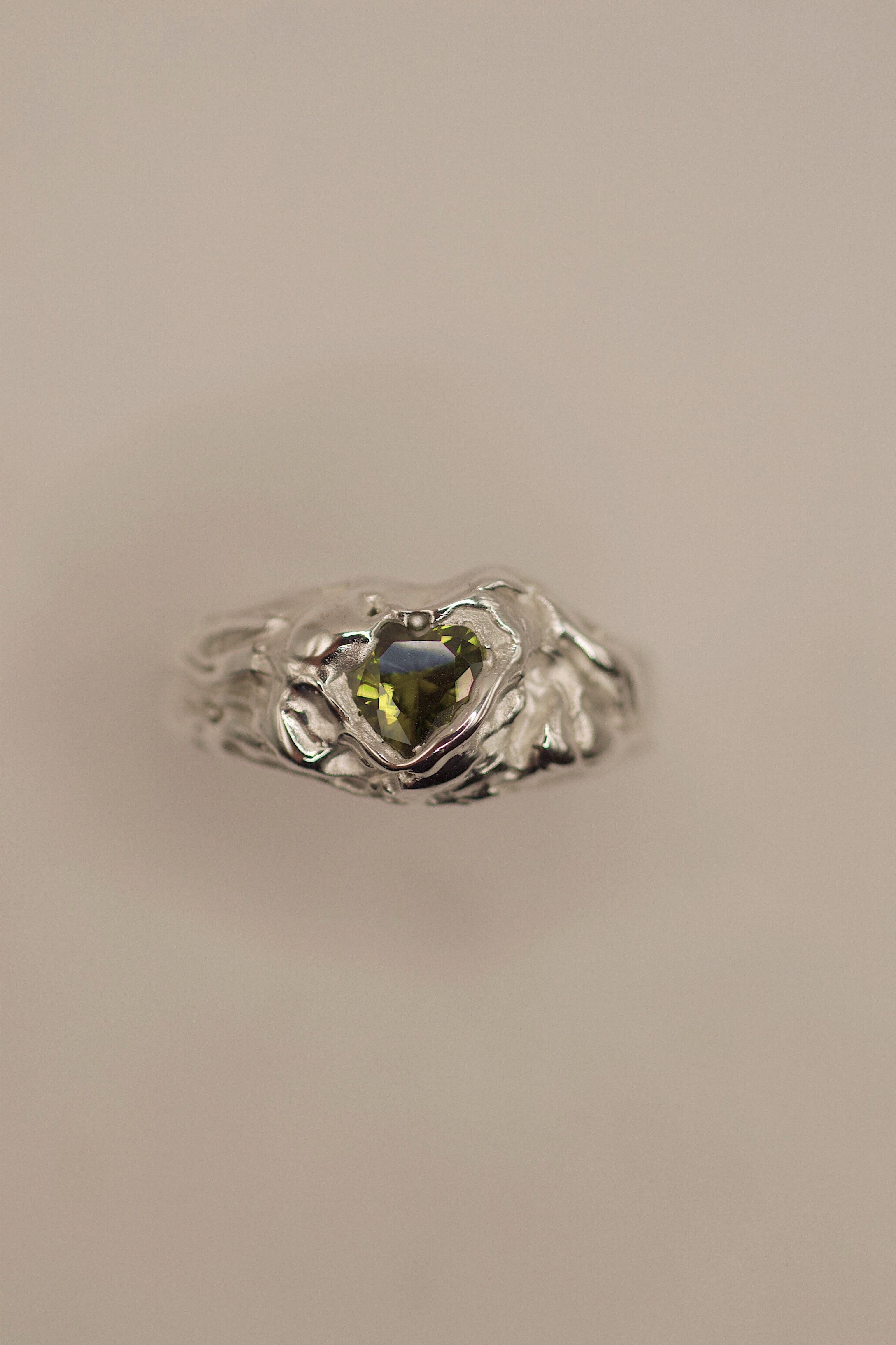 Handmade lost wax cast sterling silver ring with olive green heart cubic zirconia wrapped in textured molten silver, sweet delicate alternative ring made using the wax carving technique