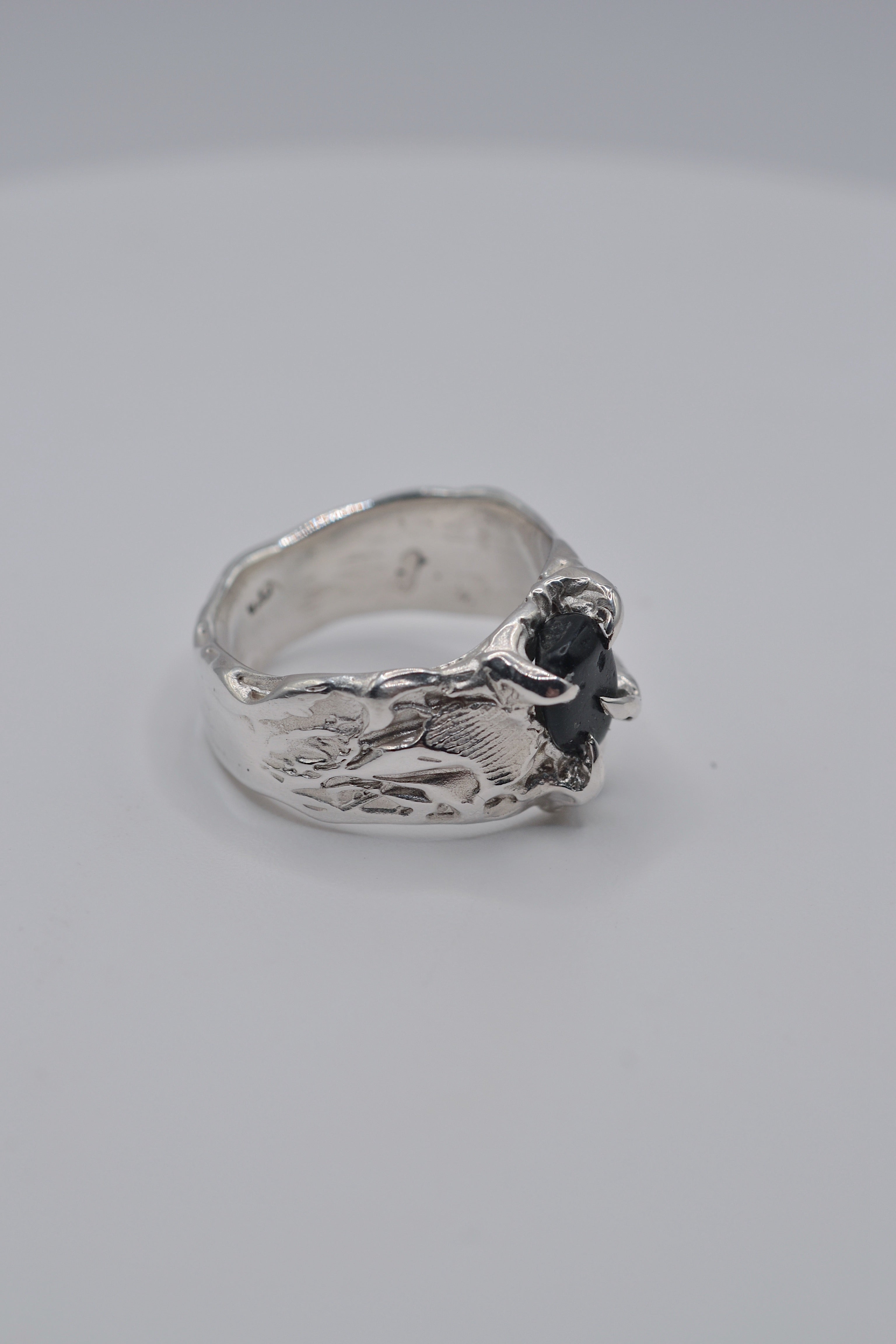 Side profile of the handmade Rattlesnake Ring showing organic recycled sterling silver band and sculptural alternative detail lost wax cast