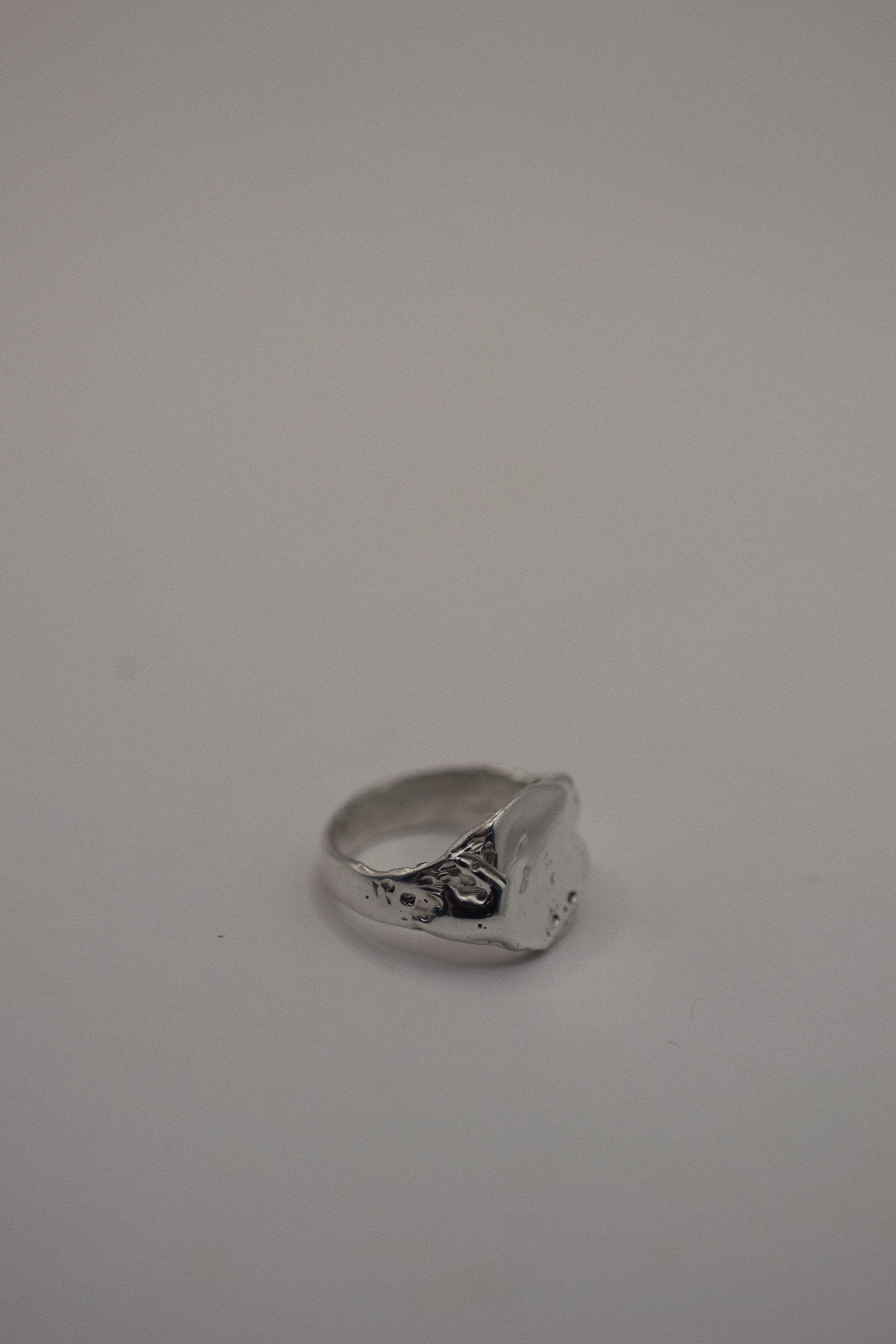 Front view of the Raw Ring showing heavily textured sterling silver signet face and dimensional organic surface handmade using lost wax casting