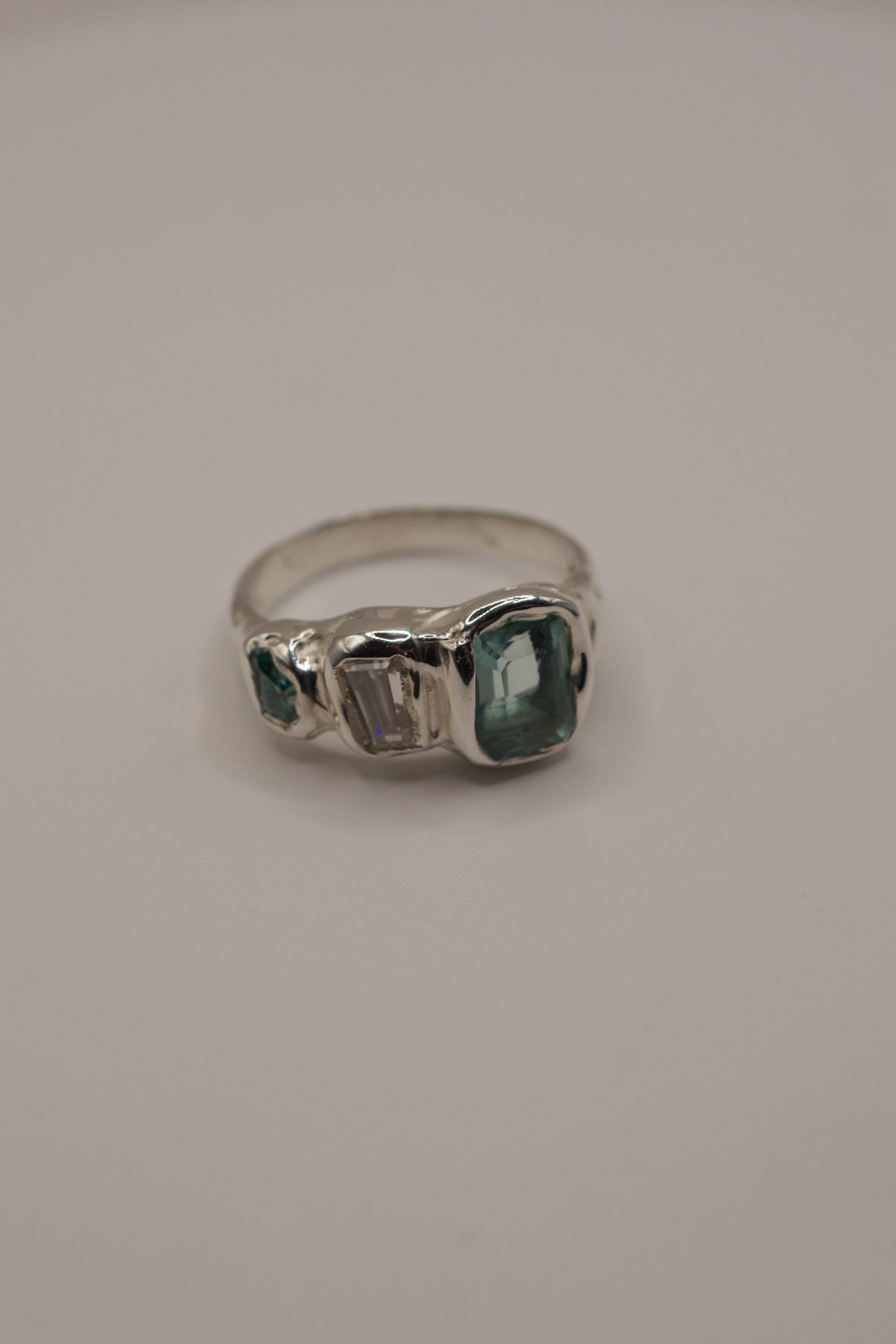 Ocean inspired sculptural alternative silver ring Seafoam Siren design lost wax cast in sterling silver with aqua tourmaline and moissanite