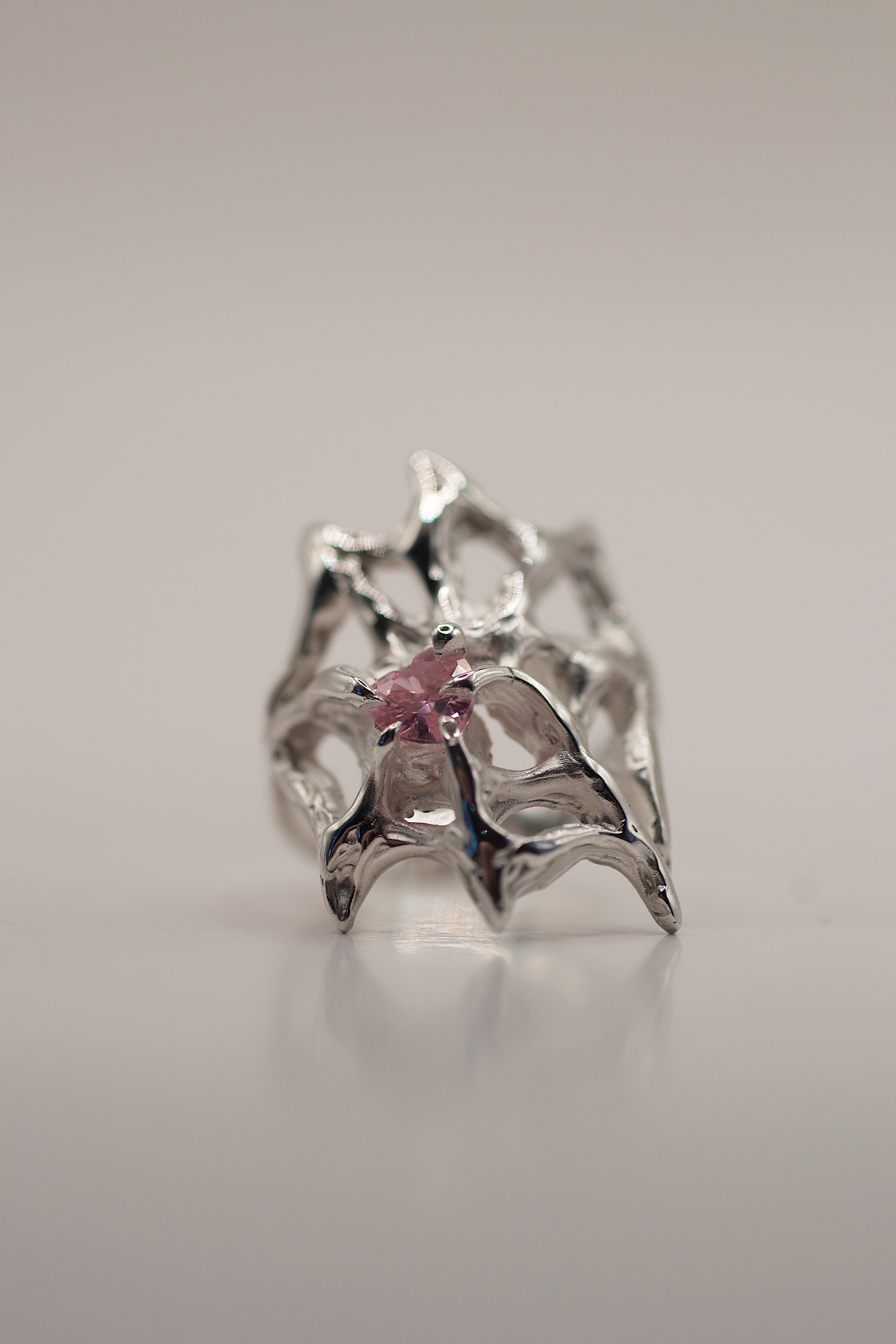 Side angle of the Silk Ring showing organic flowing recycled sterling silver web structure handmade using lost wax casting technique