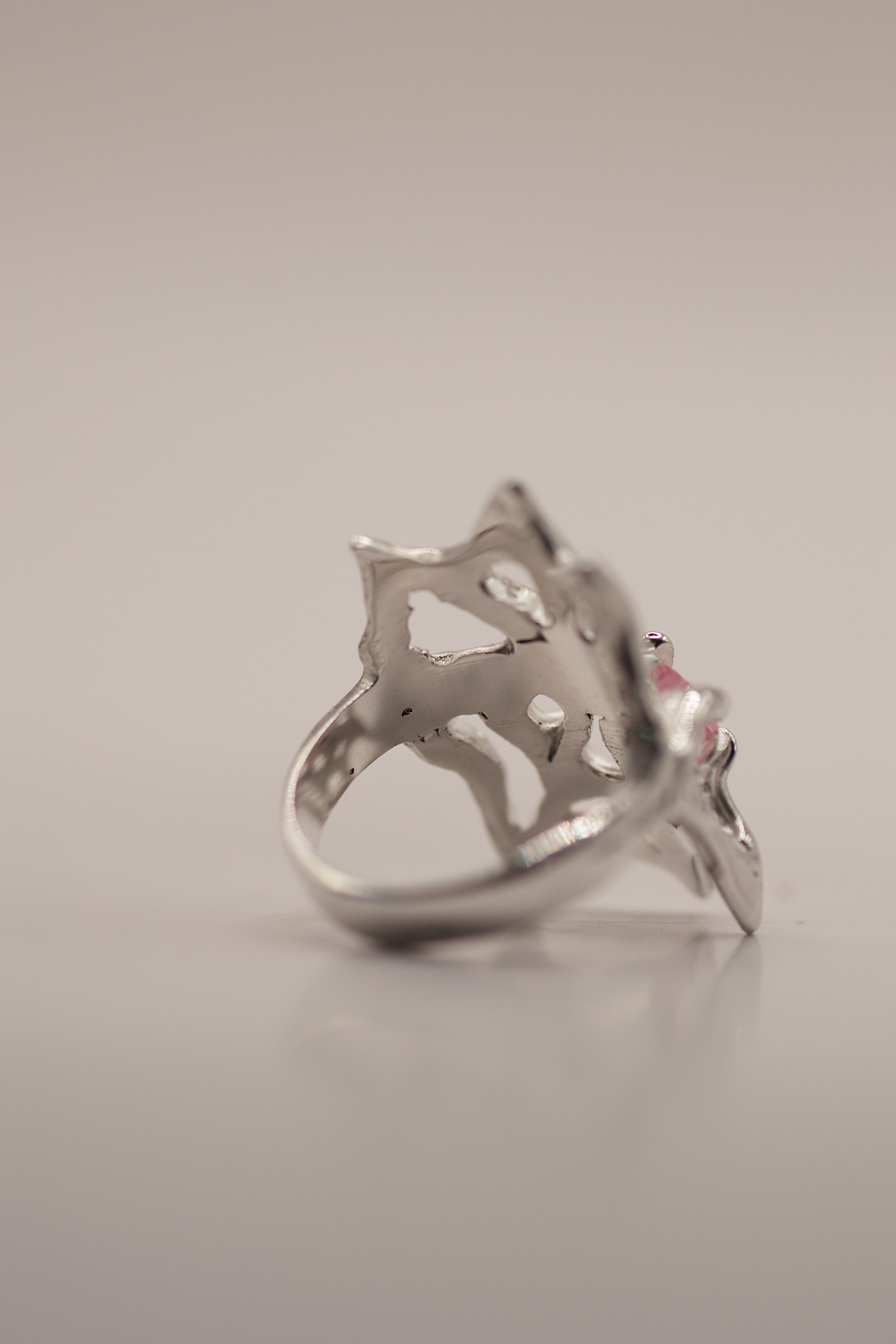 Wearable art silver ring Silk design lost wax cast with flowing web structure and pink heart cubic zirconia handmade alternative jewellery
