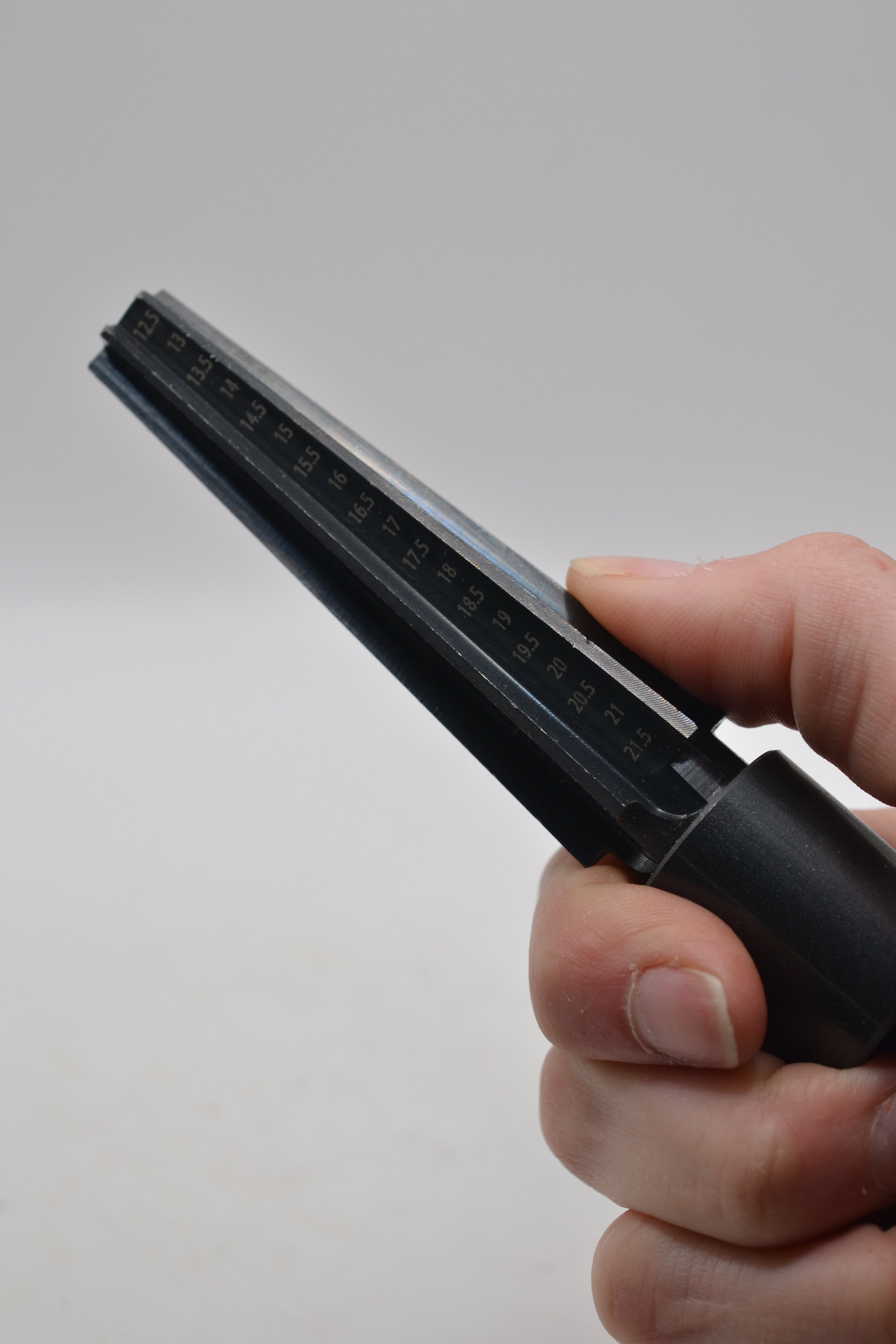 hand holding wax carving mandrel