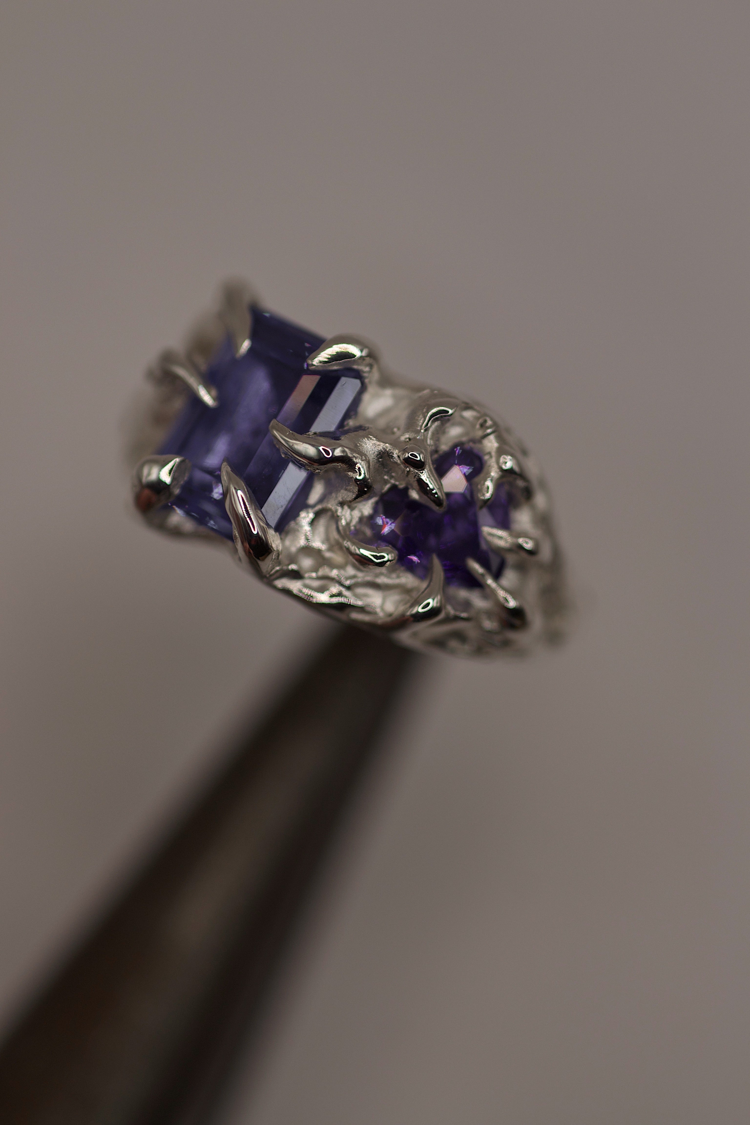 Handmade lost wax cast sterling silver ring with gothic inspired claws holding purple tourmaline and heart cubic zirconia, dark romantic alternative ring made using the wax carving technique
