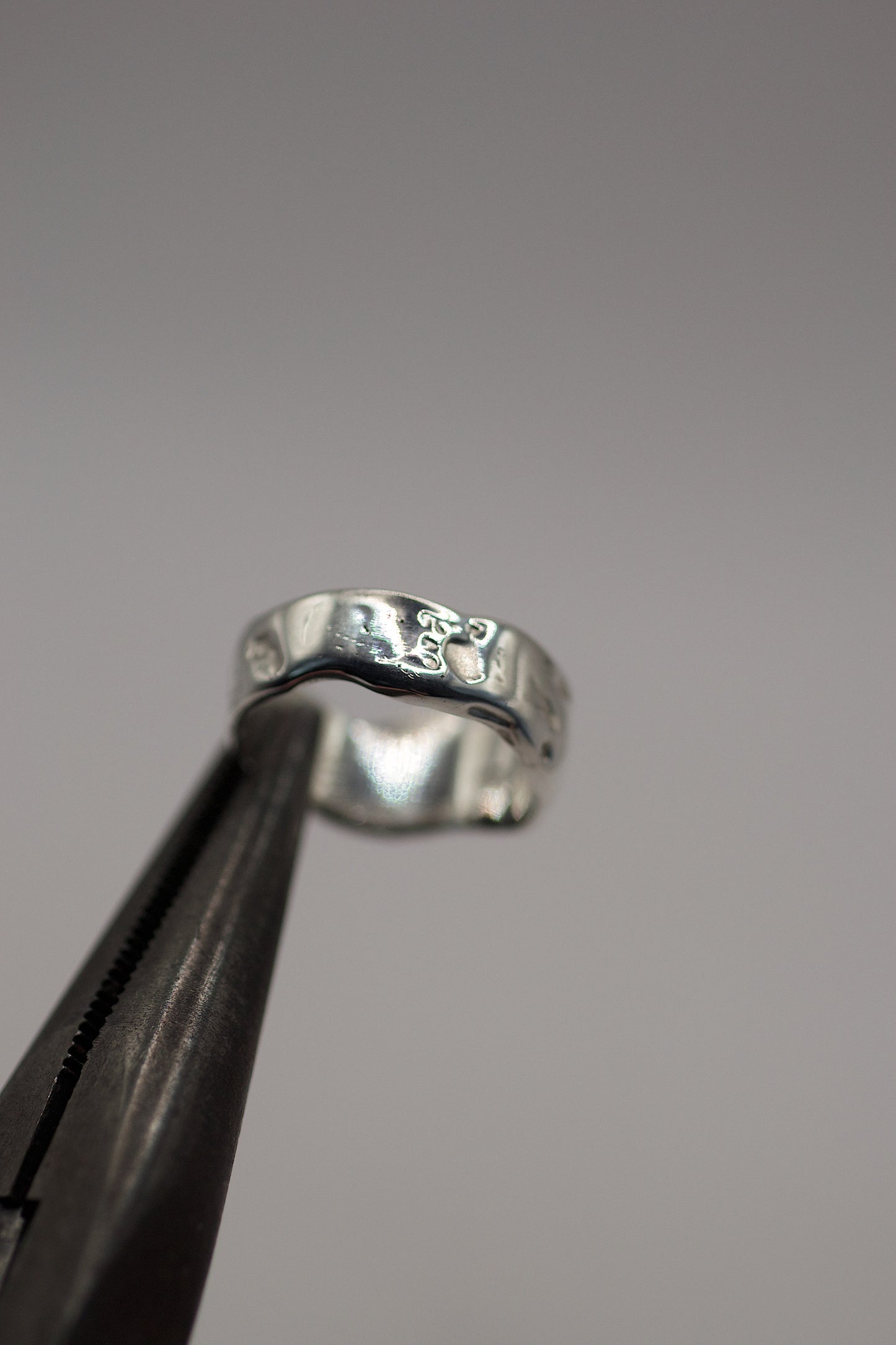  Abstract textured silver ring with a wide band, created using sculpted wax and lost wax casting technique