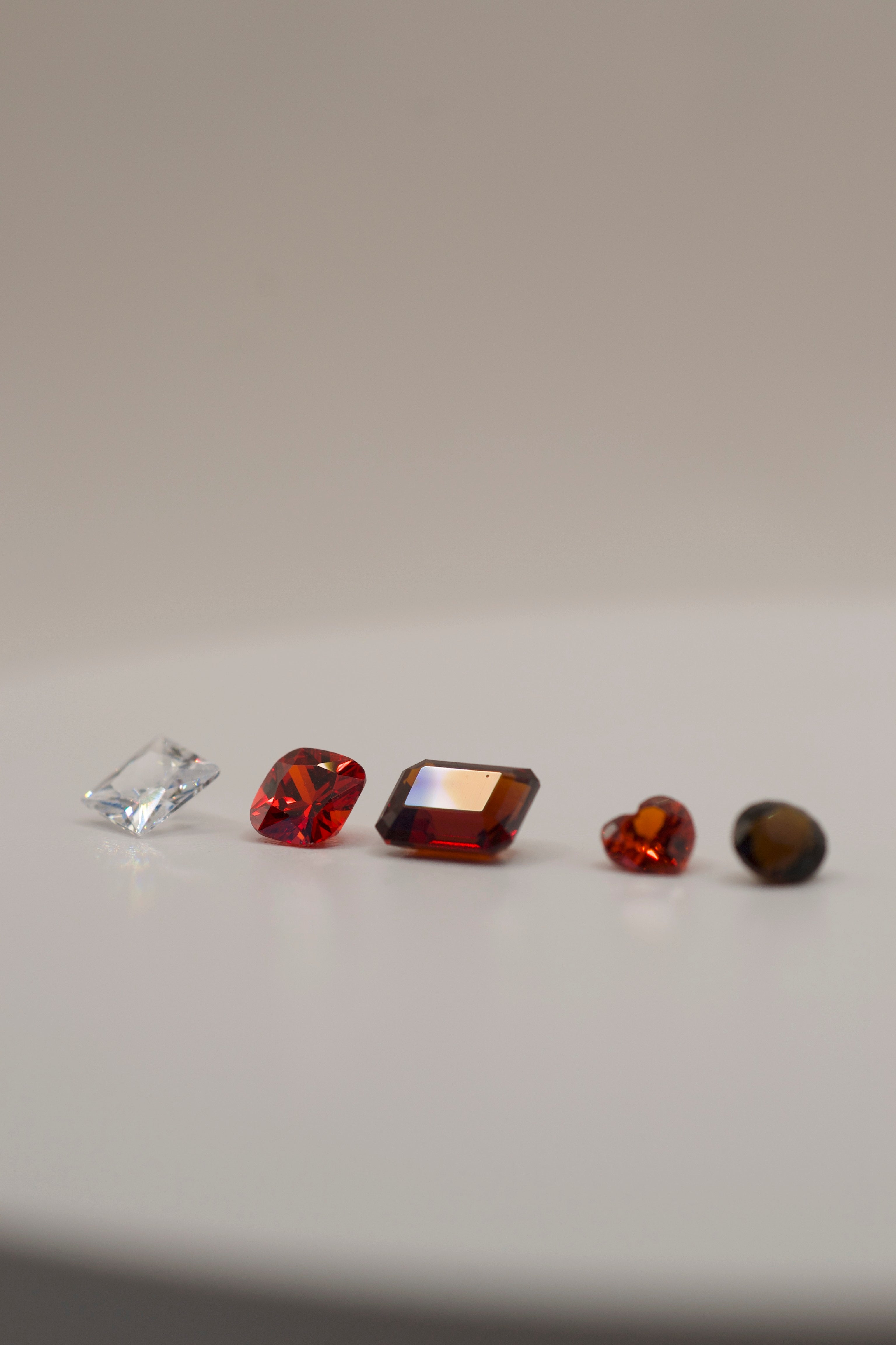 Assorted faceted gemstones used in jewelry making, suitable for casting in place with the lost wax method.