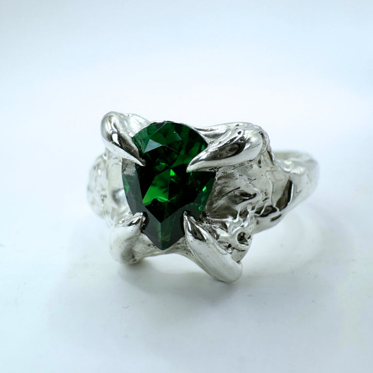 Beautiful emerald pear lab grown nano crystal. Four organic gothic claws. Gothic details and grooves on the band. Lost wax carved ring.