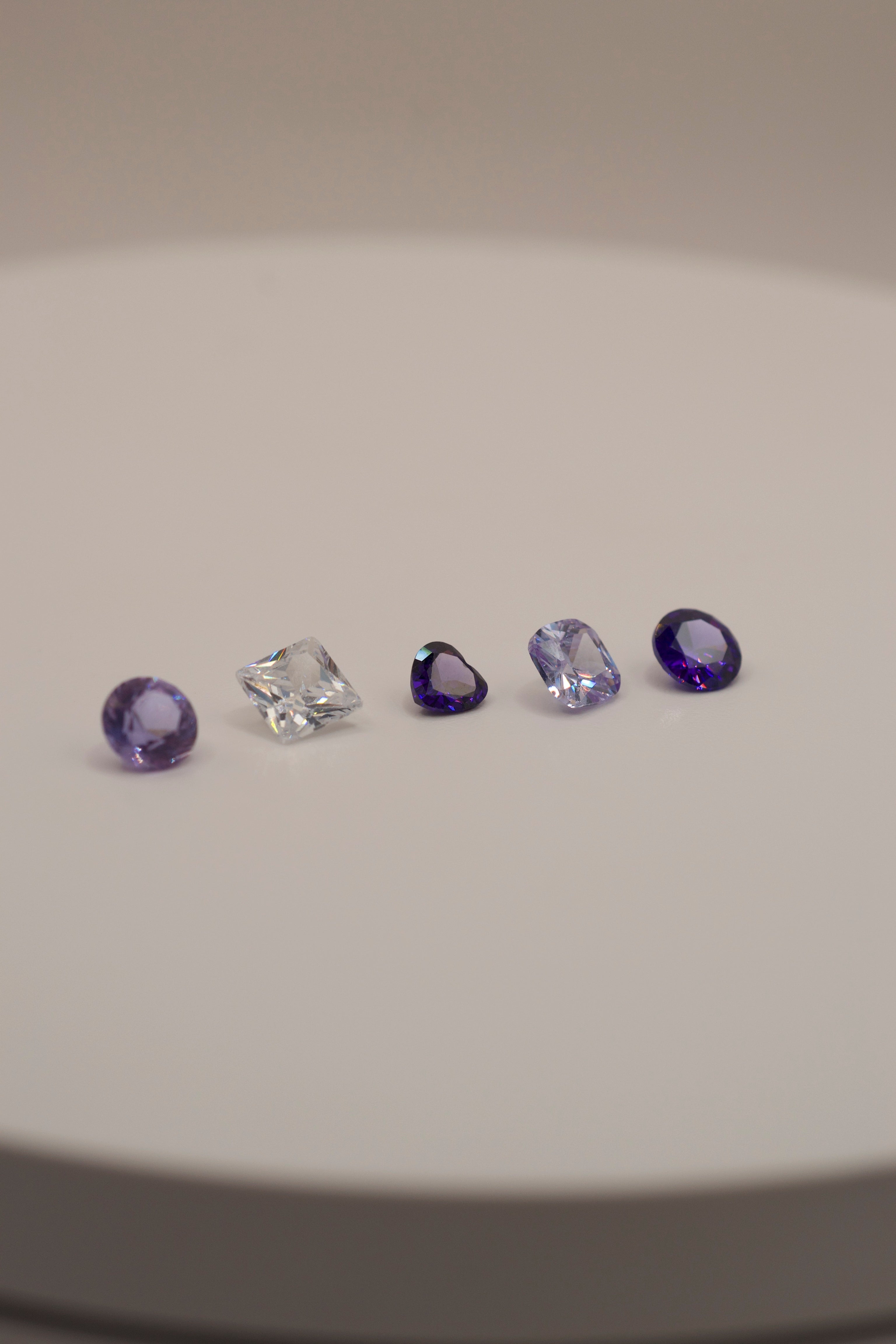 Jewellery gemstones for cast in place lost wax method — purple and clear faceted stones perfect for beginners and professional jewellery makers.