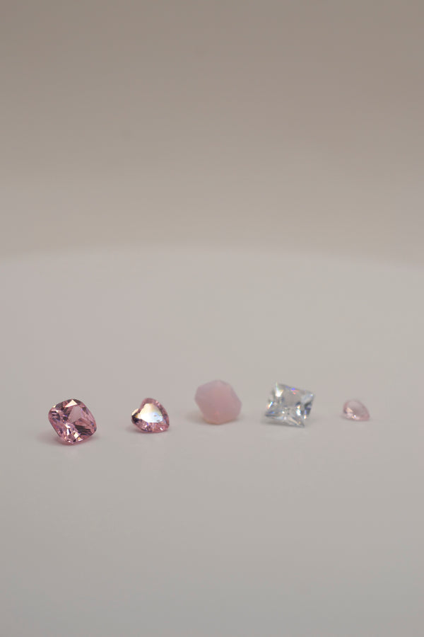 Selection of pink and clear faceted gemstones, designed for cast in place wax carving jewelry making in silver and gold.
