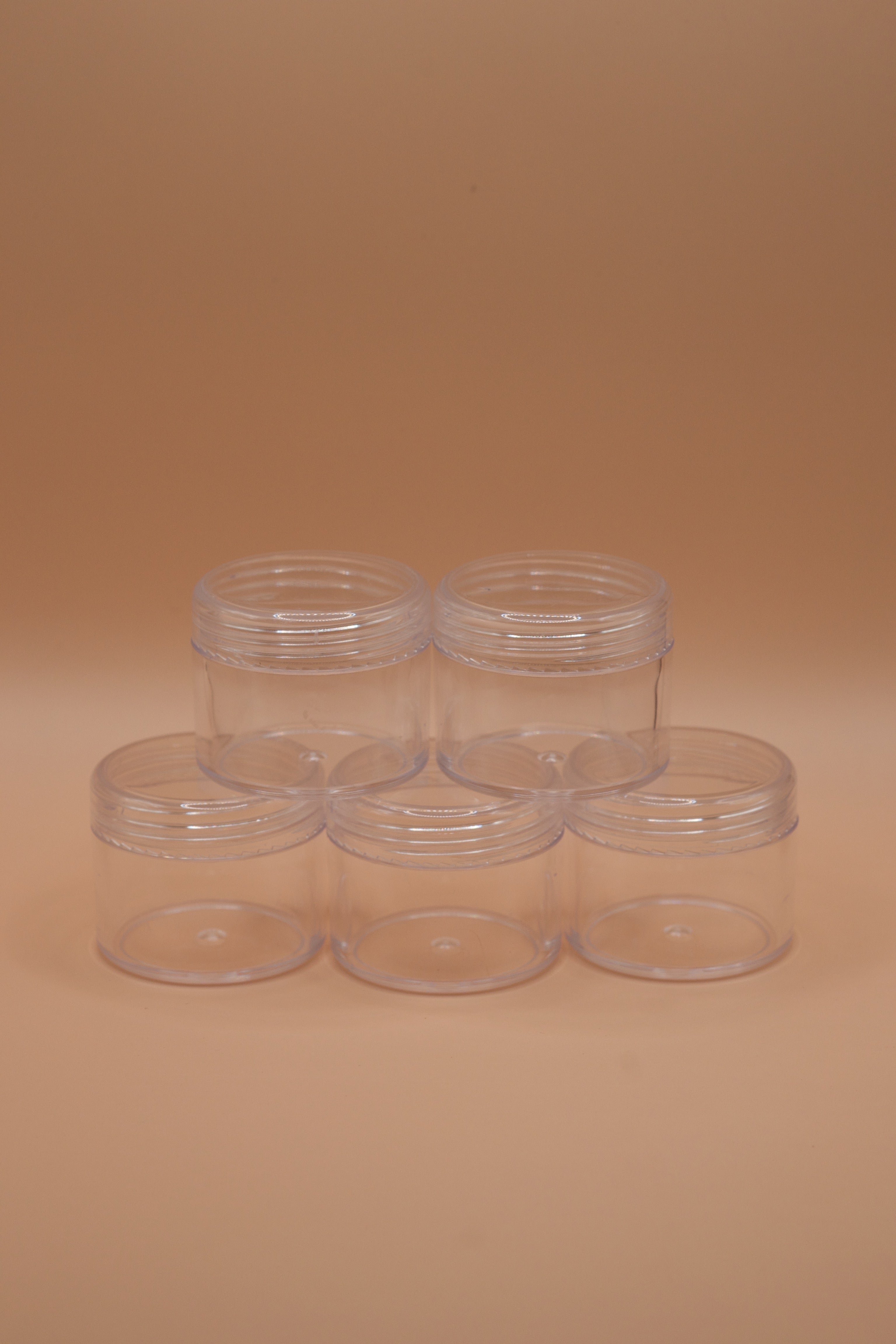 Set of five clear plastic jars for safely sending wax jewellery models to a casting house. Screw-top lids.