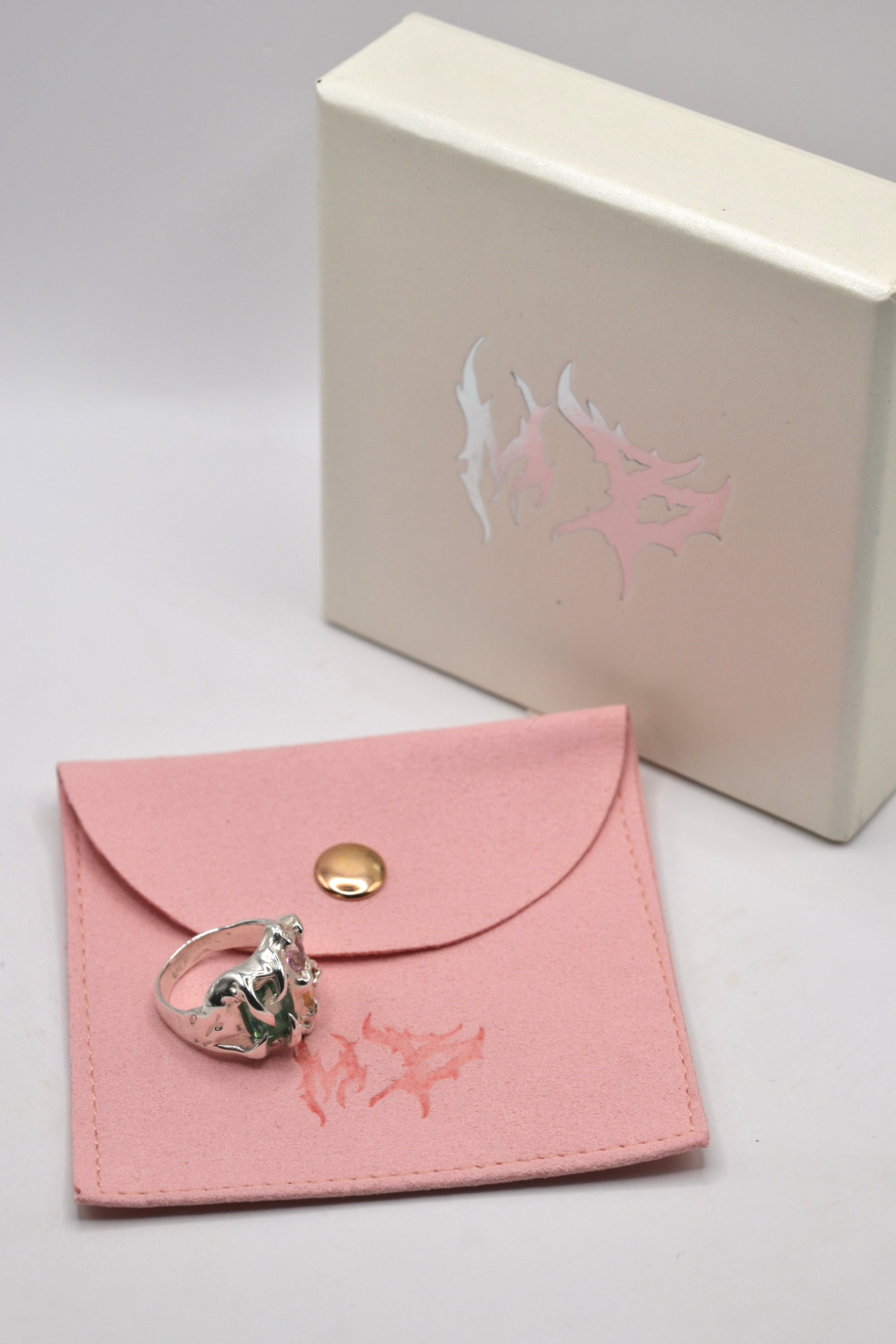 The Mirage ring with gift packaging. Handmade organic silver, individually wax carved and lost wax cast. Unique alternative jewellery. Metal Bones Jewellery.