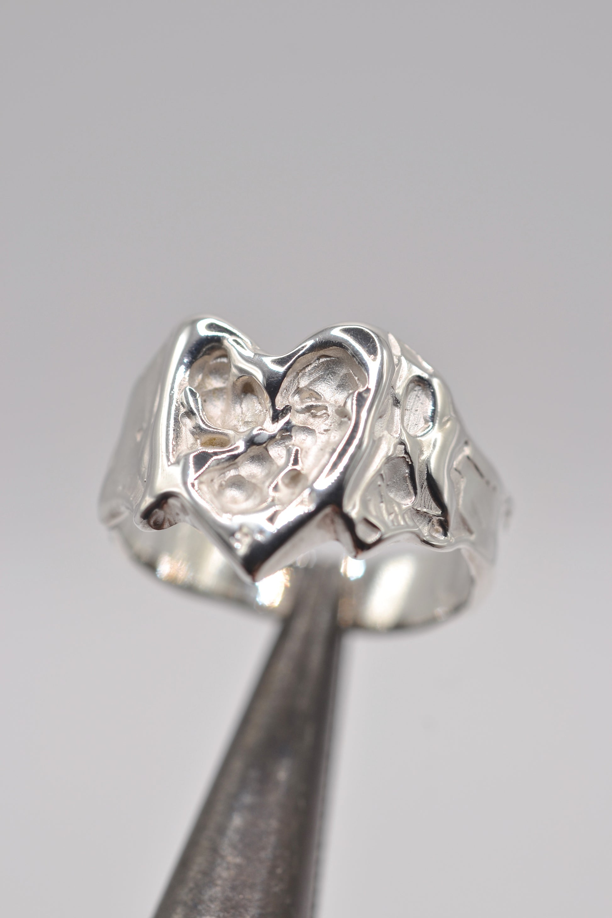 Organic lost wax cast ring in sterling silver with sculptural molten heart design, handmade alternative jewellery