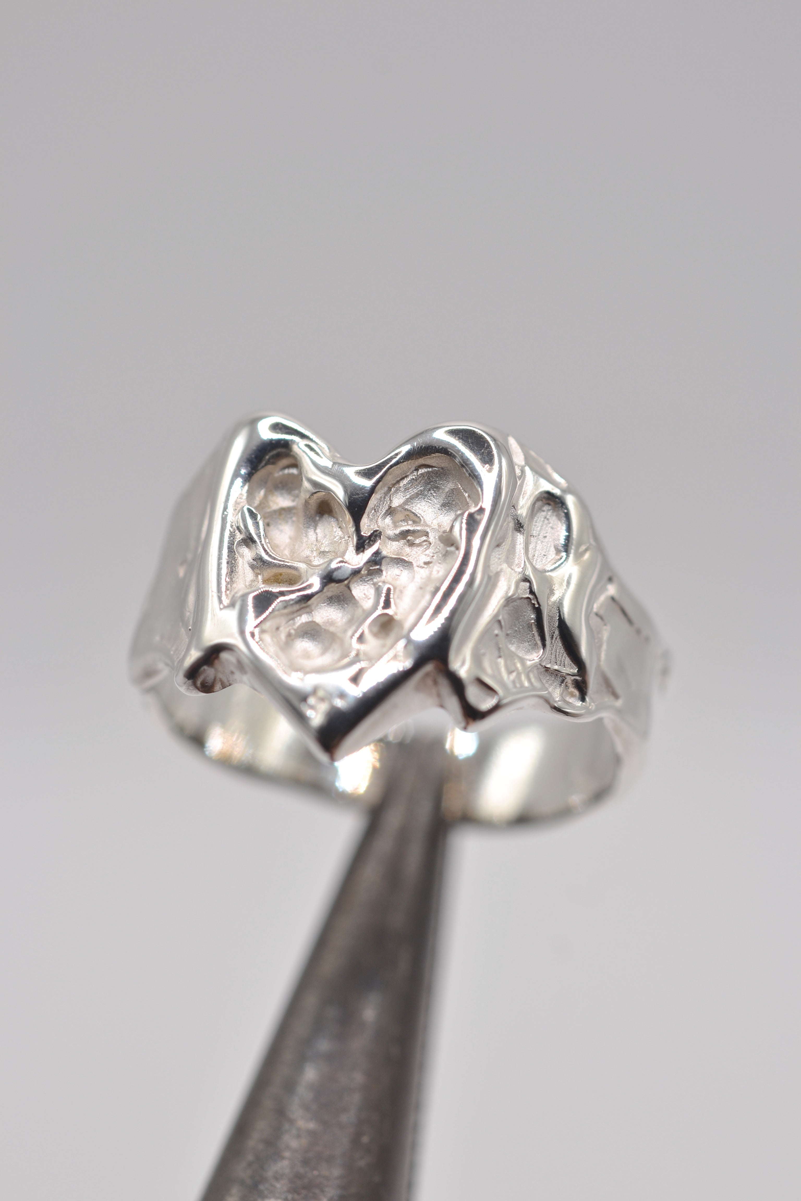 Organic lost wax cast ring in sterling silver with sculptural molten heart design, handmade alternative jewellery