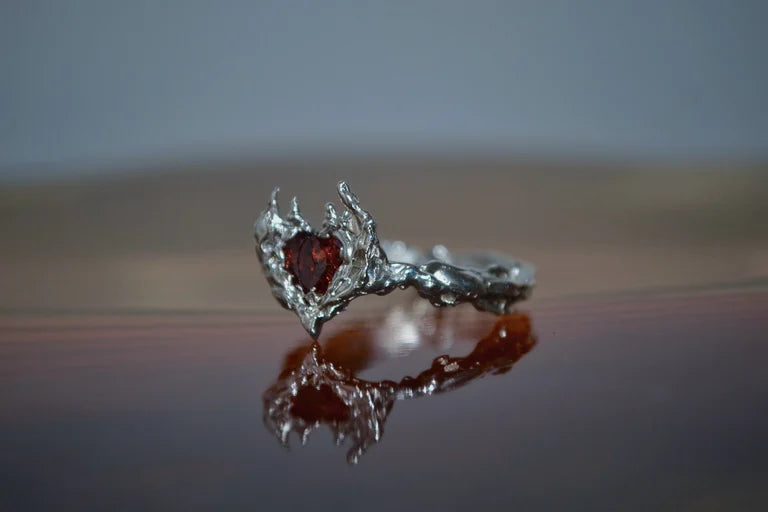 Sterling silver molten metal heart shape garnet cubic zirconia, organic textured design hand carved from wax.