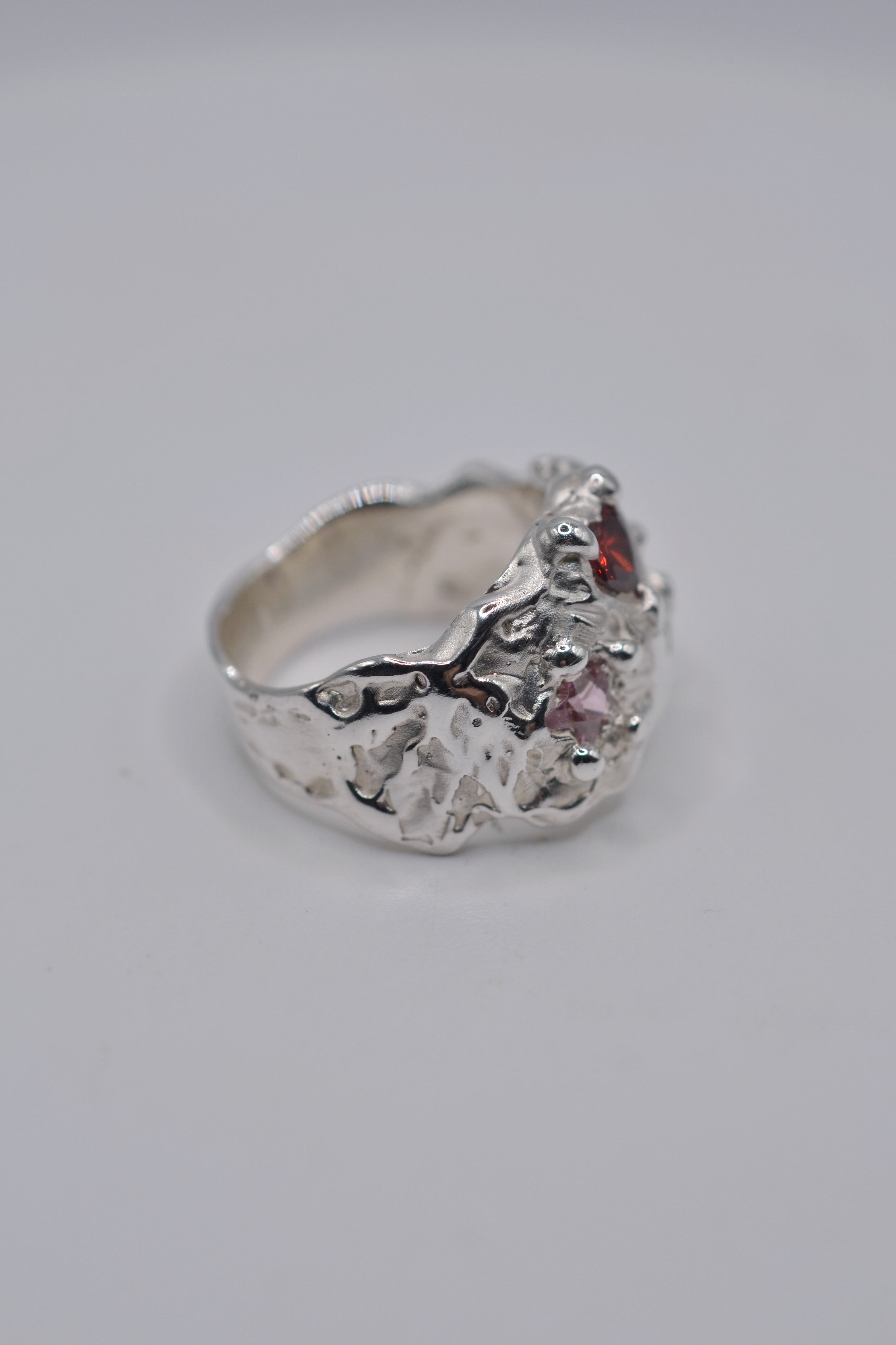 Side profile of the cosmic cowgirl ring. Organic, sculptural, molten. Handmade sterling silver lost wax ring. Metal Bones Jewellery.