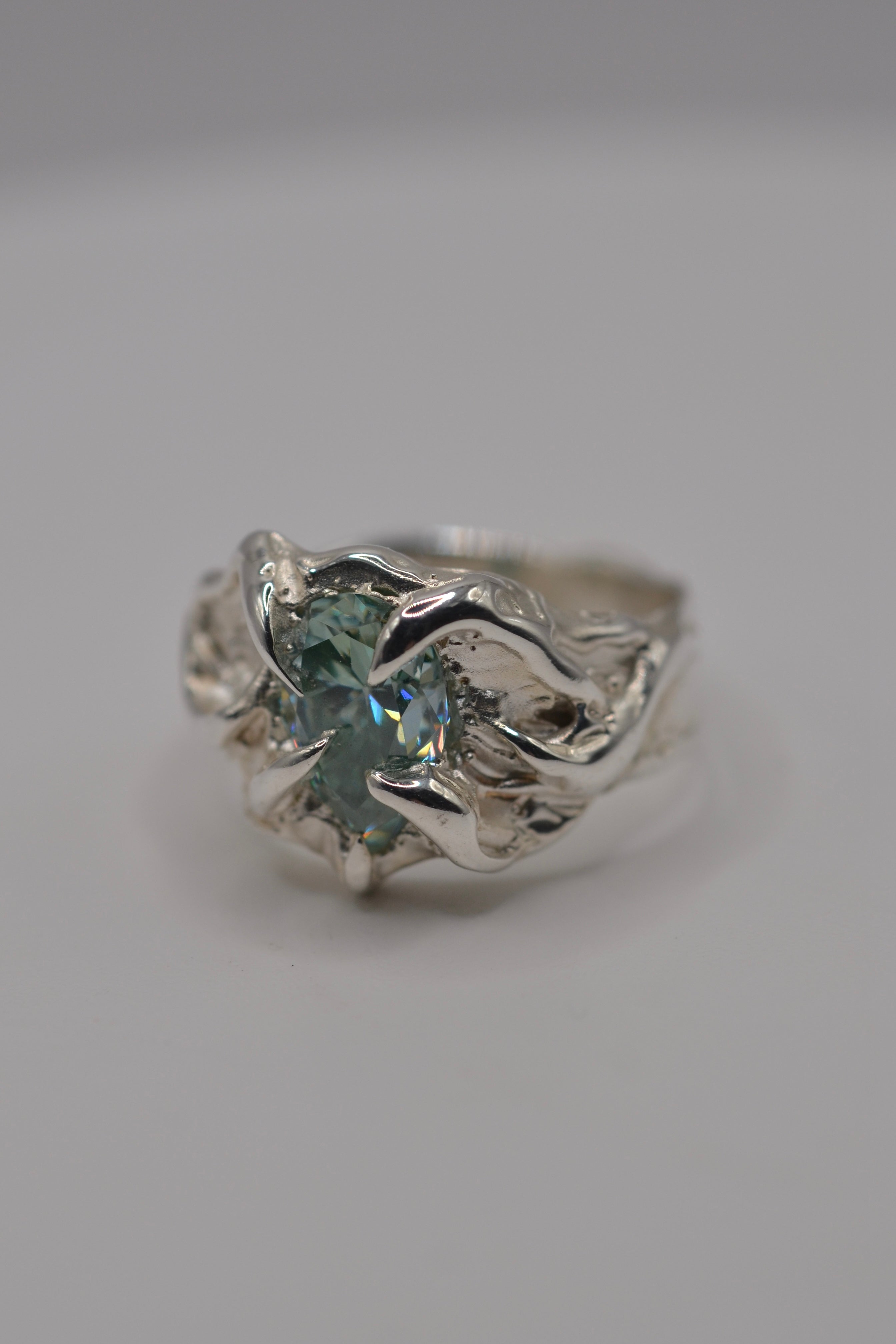The Wrangler ring flat lay. Handmade from scratch using wax carving and lost wax casting. Unique alternative engagement ring in organic silver. Metal Bones Jewellery.