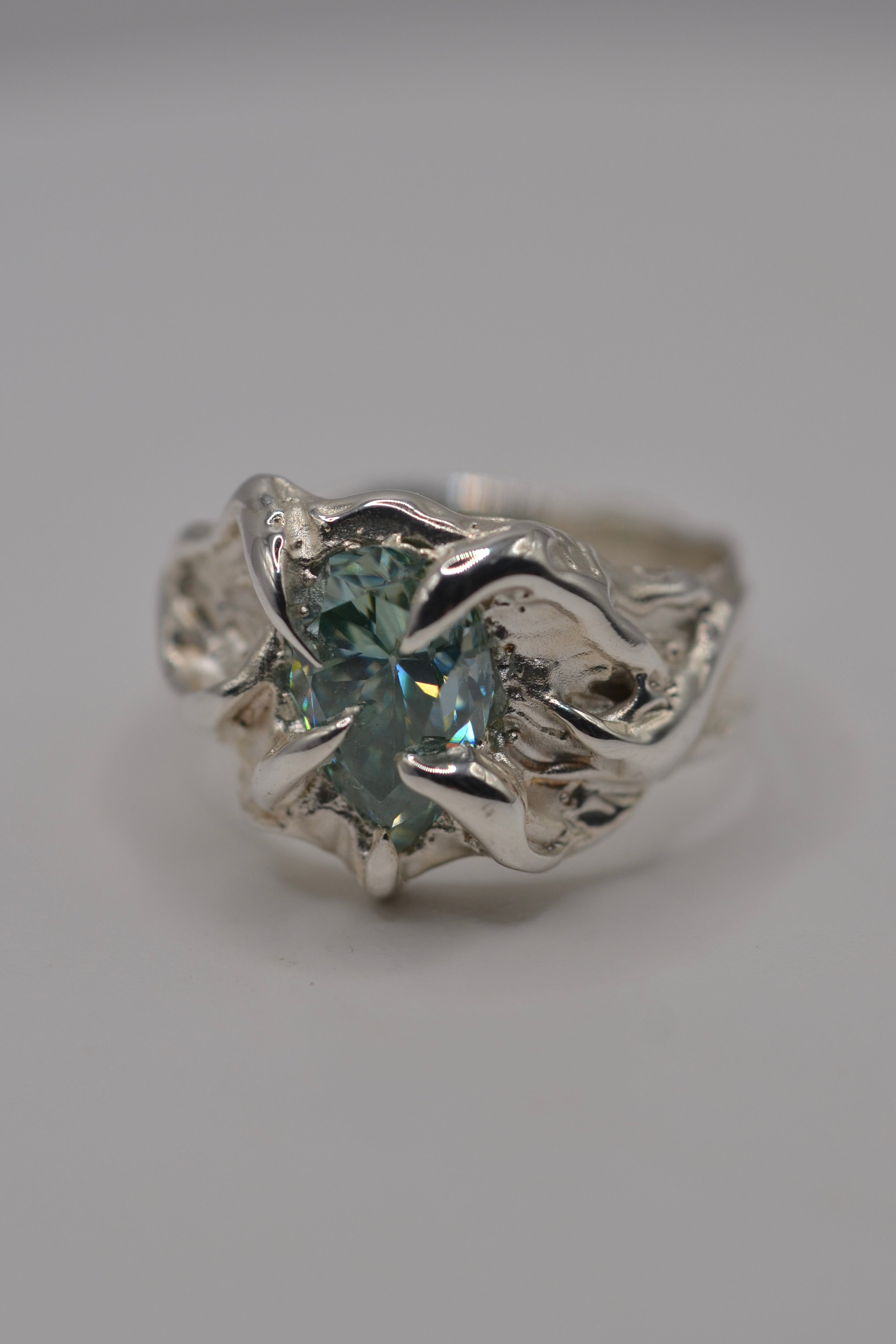 The Wrangler. Handmade organic silver ring sculpted using wax carving and lost wax casting. Blue stone, unique alternative engagement ring. Designed and made by Cassandra Djodan, Metal Bones Jewellery.