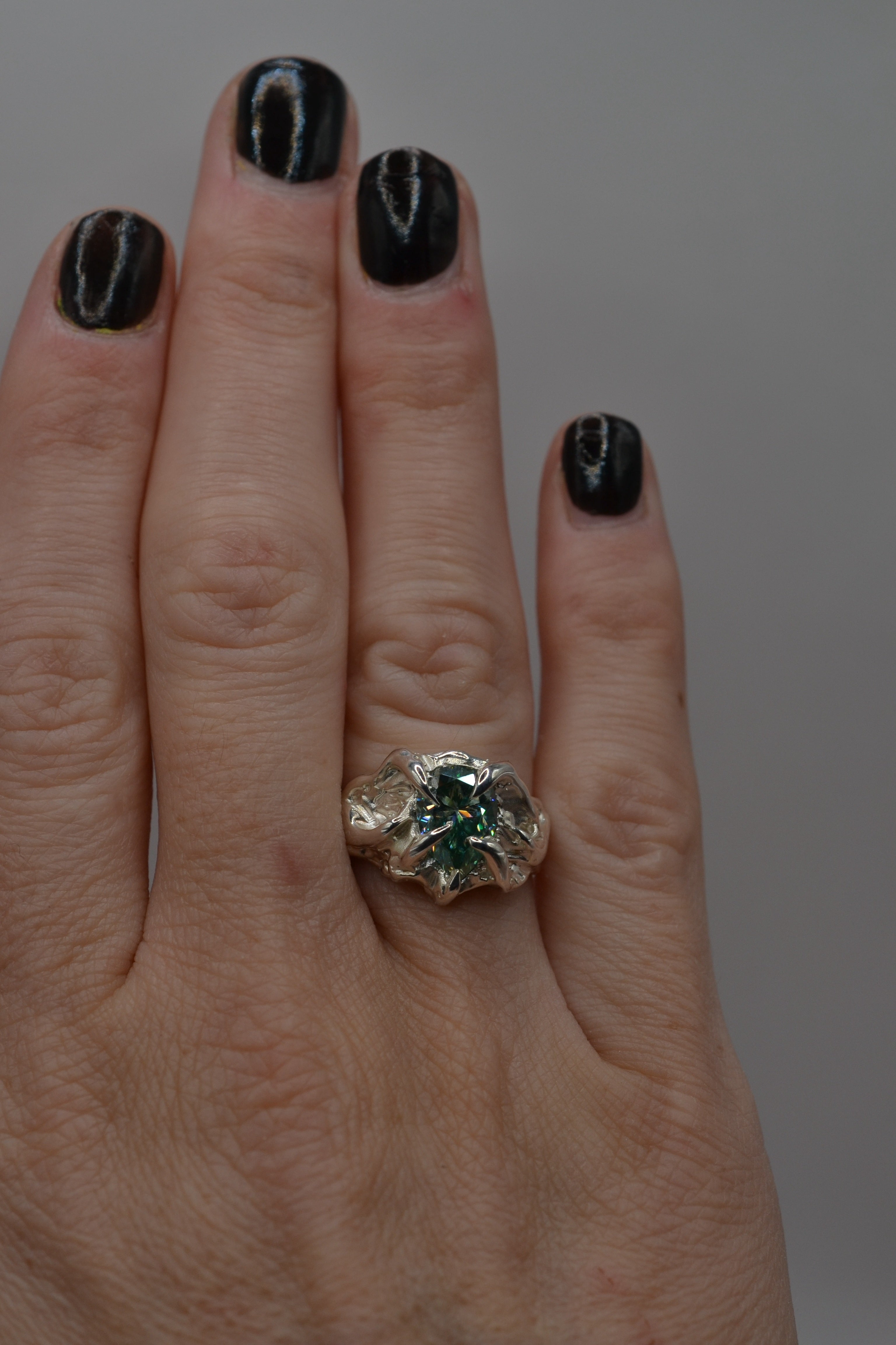 The Wrangler worn with dark nails. Handmade organic silver ring, wax carved and lost wax cast. Unique alternative engagement ring. Metal Bones Jewellery.