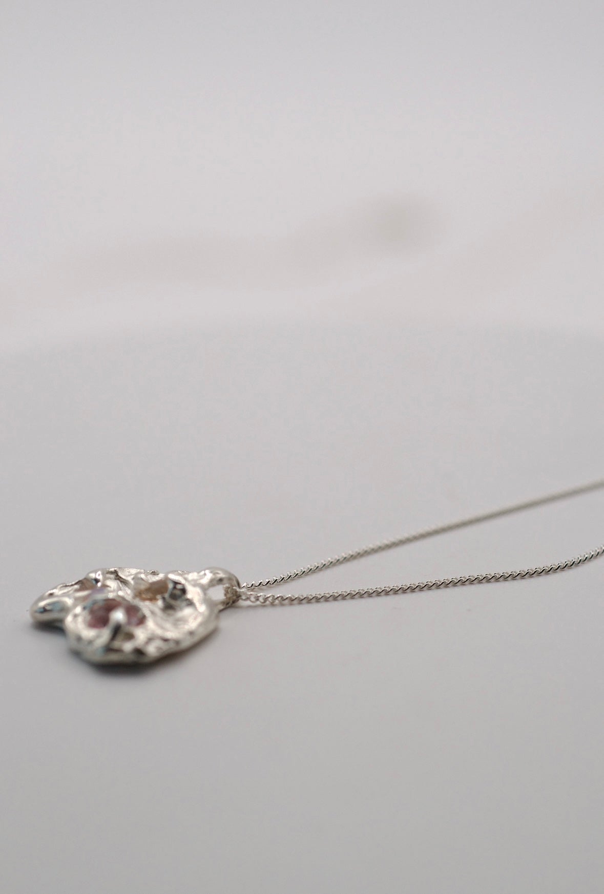 Handmade lost wax cast sterling silver Candy Pendant worn on diamond-cut curb chain sculptural alternative silver necklace