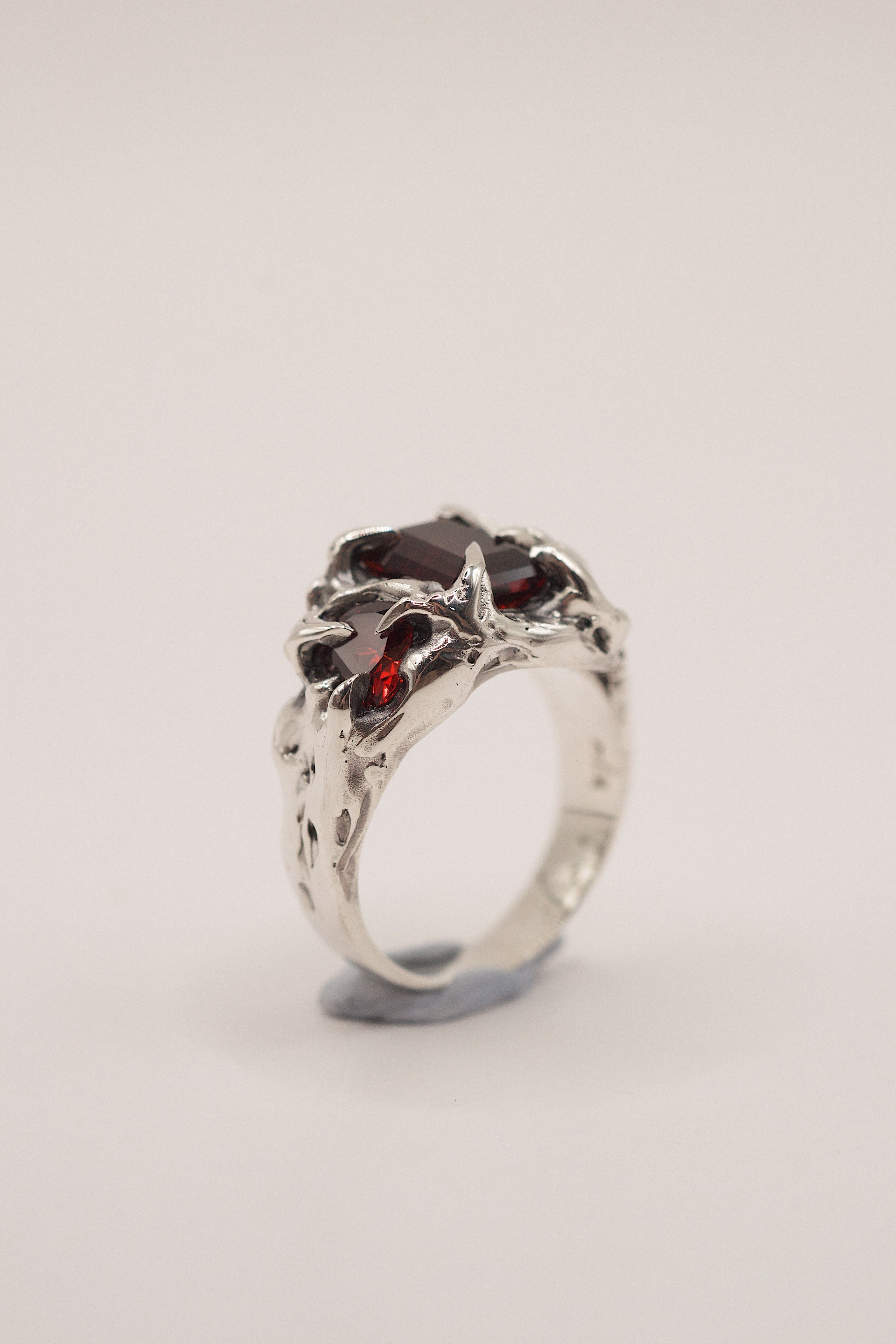 Unique handmade alternative jewellery Cherry Ring lost wax cast in recycled sterling silver with red garnet and organic dark claws