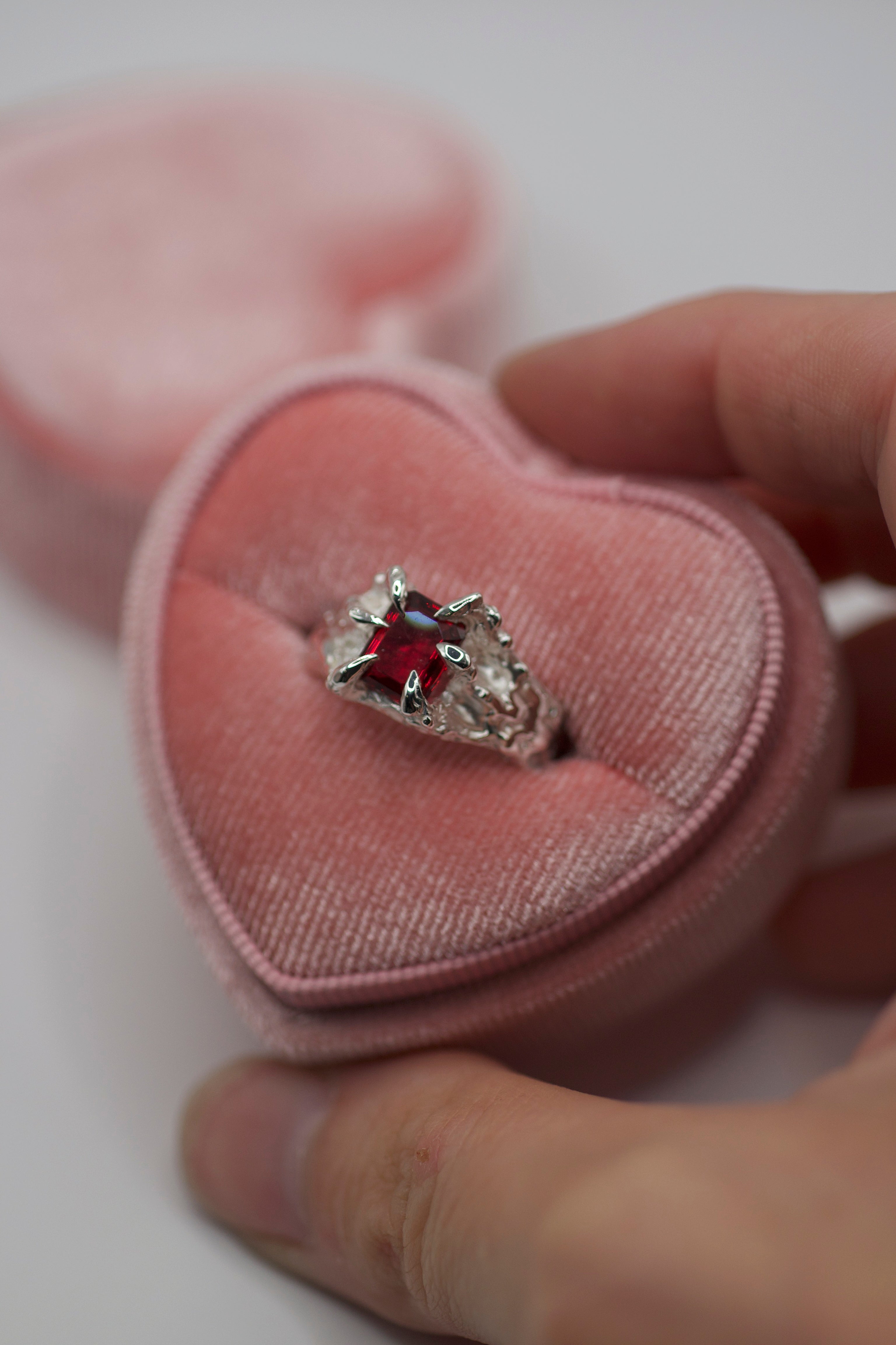 Lost wax cast silver Dragon Ring with red lab-grown crystal in heart shaped velvet ring box handmade sculptural alternative engagement ring made using the wax carving technique