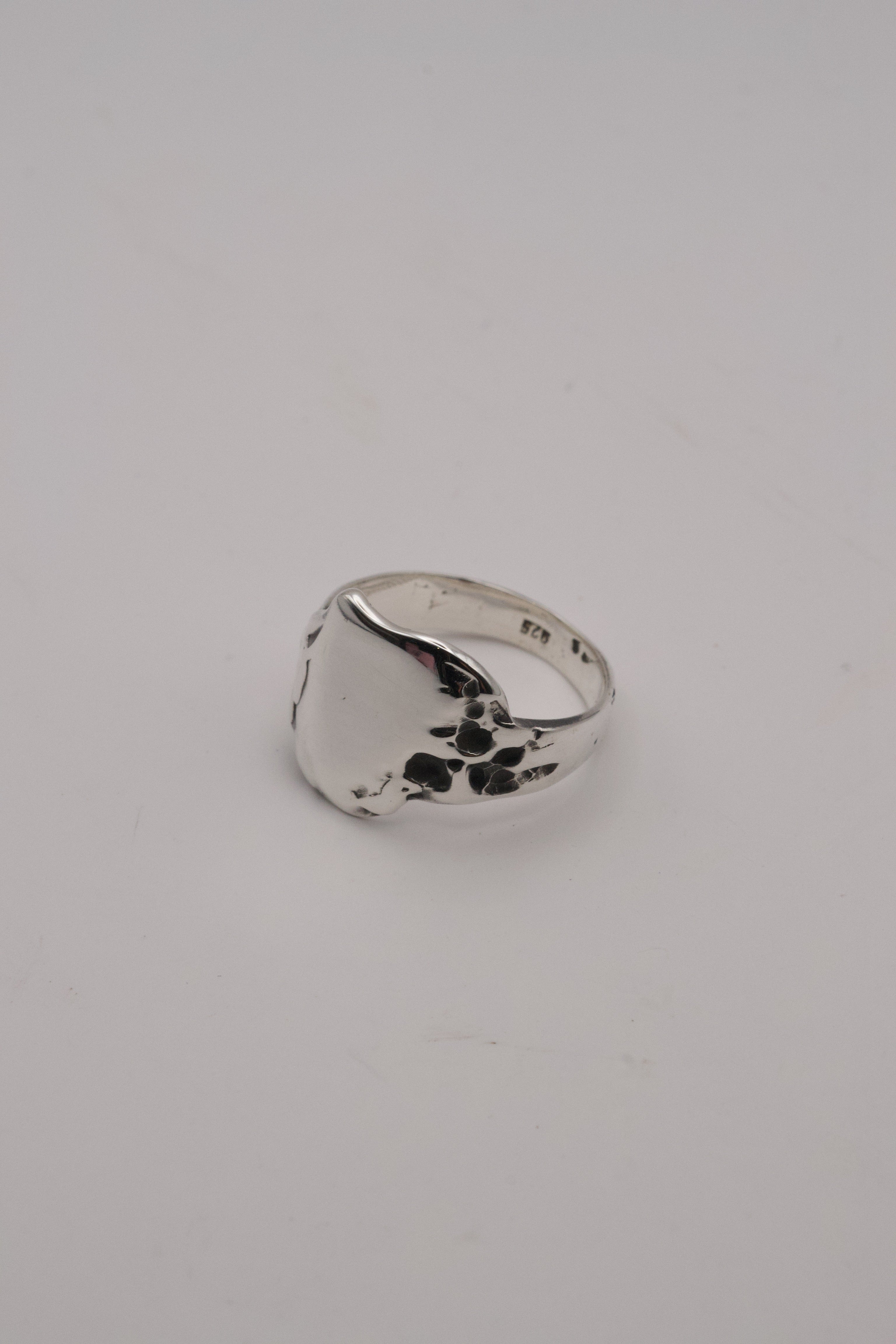 Sculptural alternative silver signet ring Duality design lost wax cast in darkened recycled sterling silver with dimensional organic texture