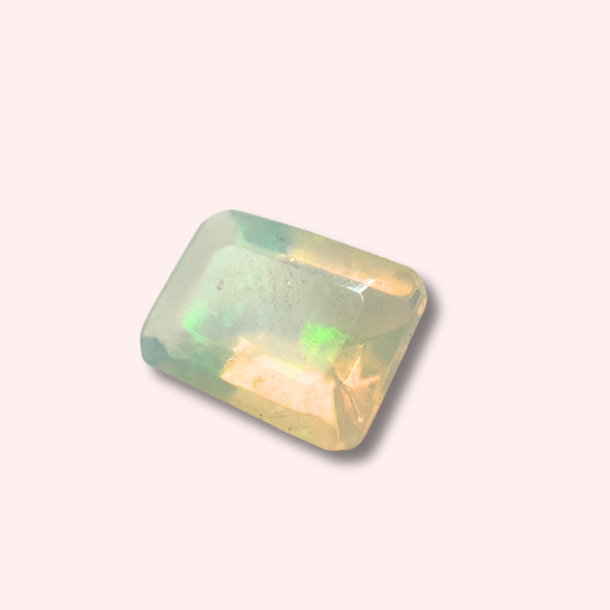 Natural Ethiopian Opal rectangular octagon-cut gemstone with stunning color play, ideal for casting in lost wax jewelry.