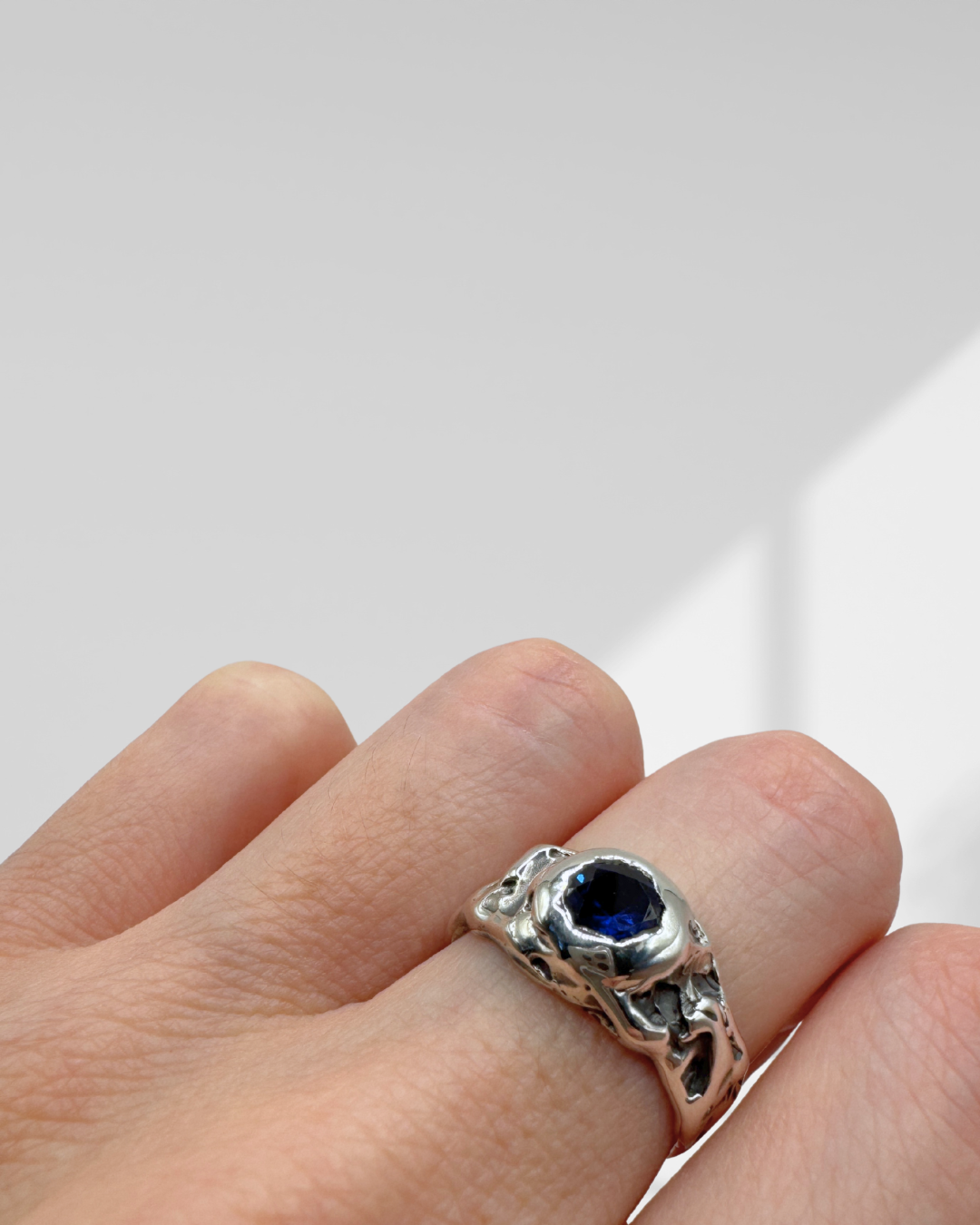 organic molten textured ring with round sapphire