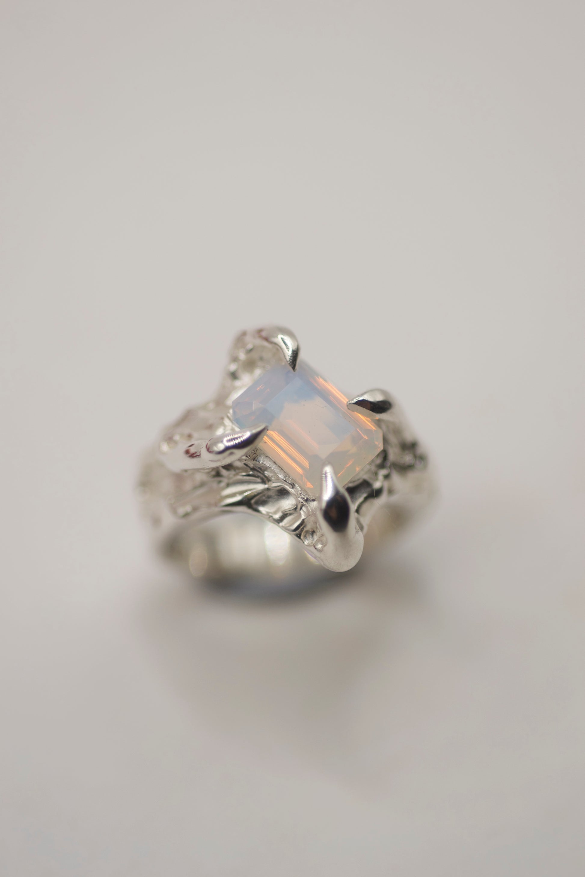 organic silver ring with emerald cut lab grown milky opal nano crsytal