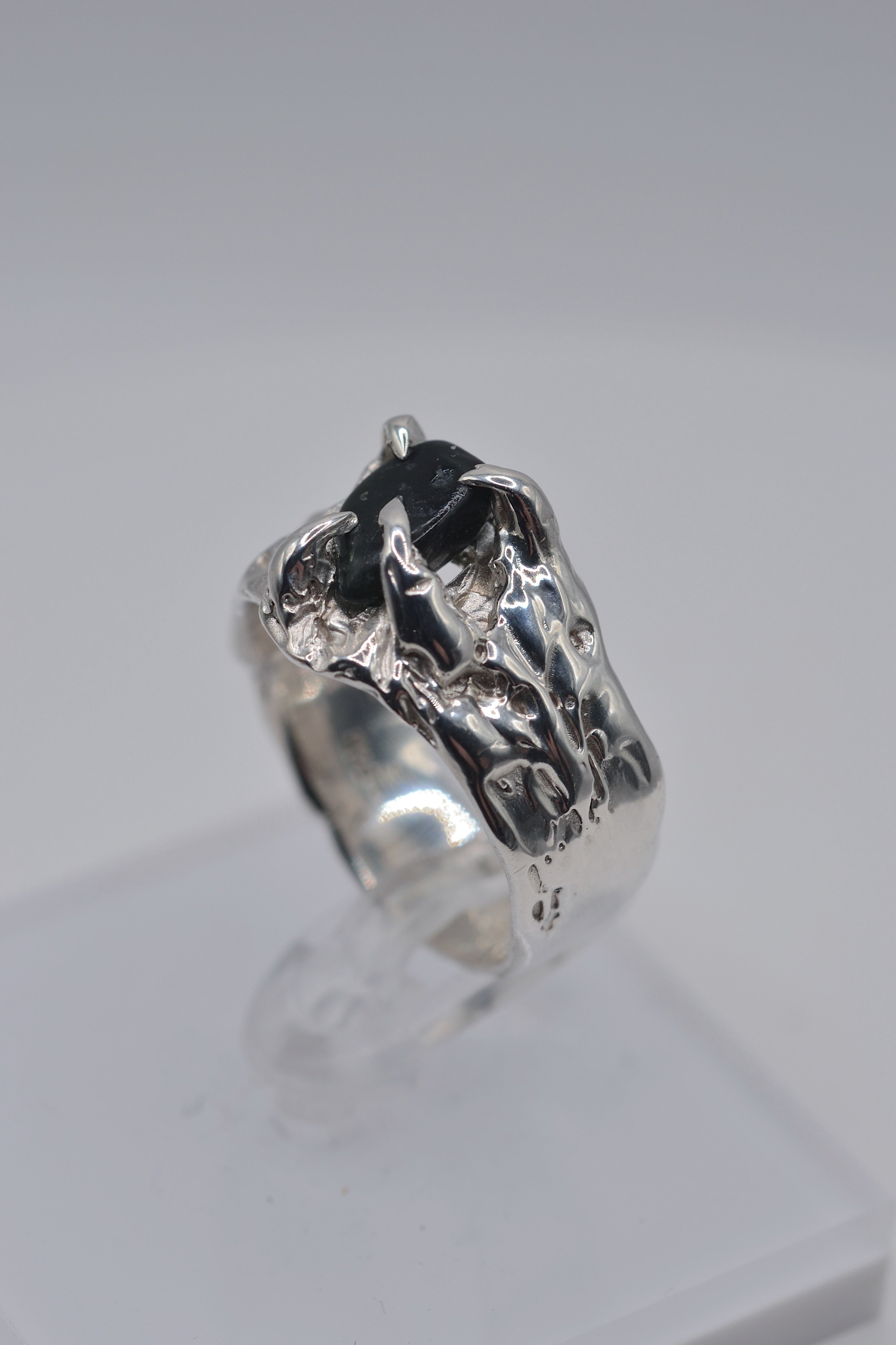 Side angle of the Rattlesnake Ring showing organic recycled sterling silver band handmade using the lost wax casting technique
