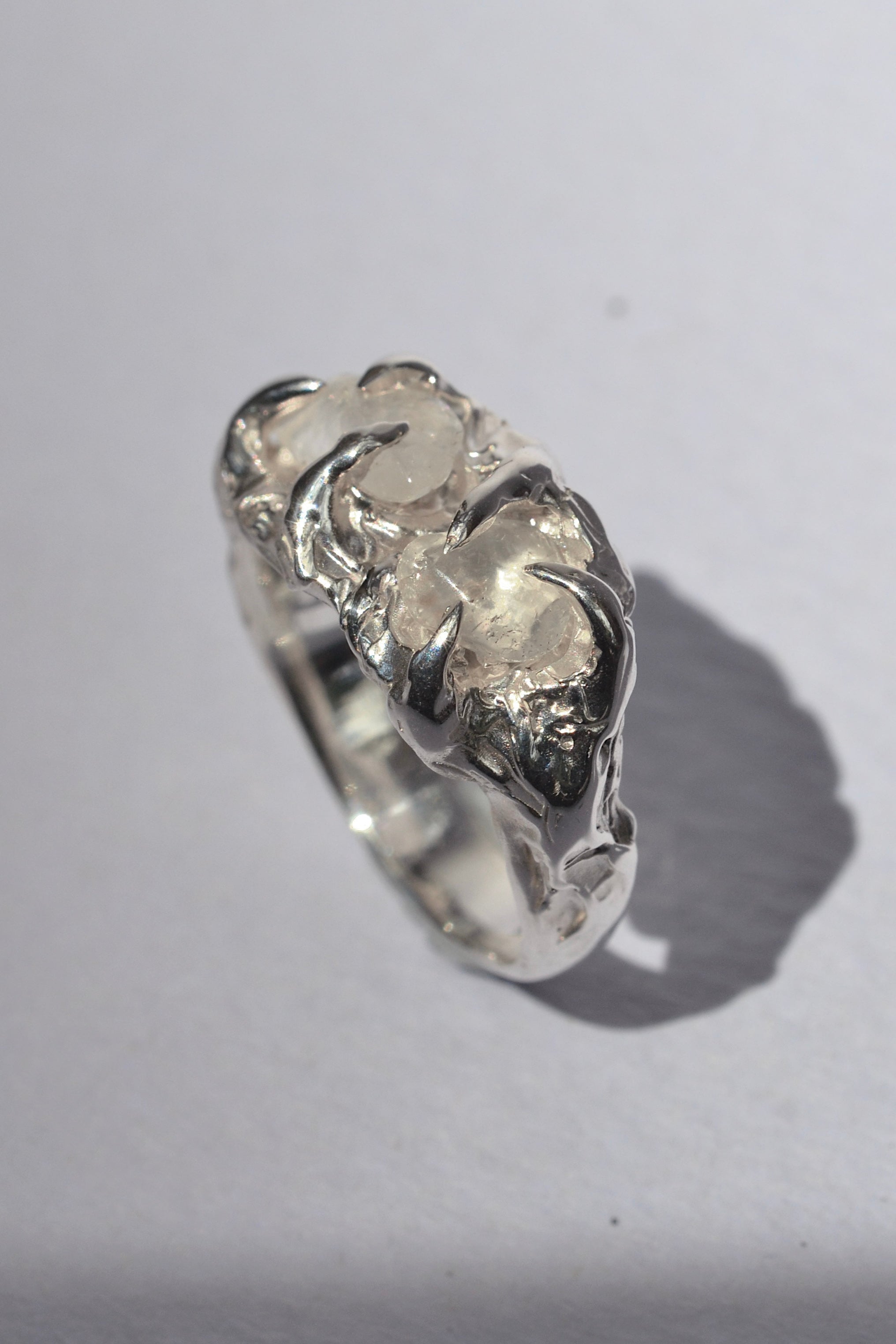 Gothic inspired sculptural sterling silver ring with raw quartz crystals and organic molten claw setting handmade using lost wax casting
