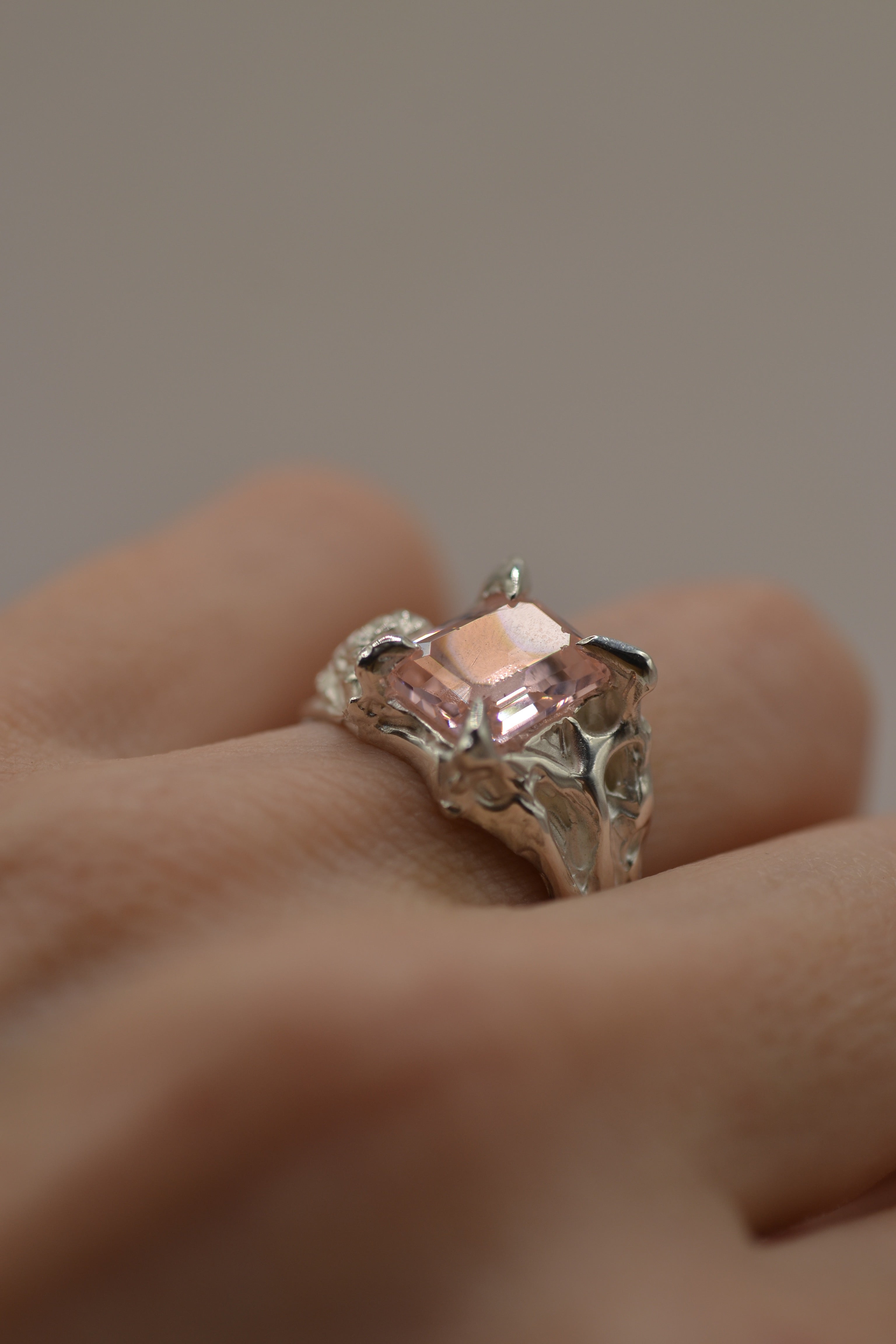 Close up of the Rosabelle Ring showing sculpted sterling silver rose petals and pink lab-grown tourmaline handmade using the lost wax technique