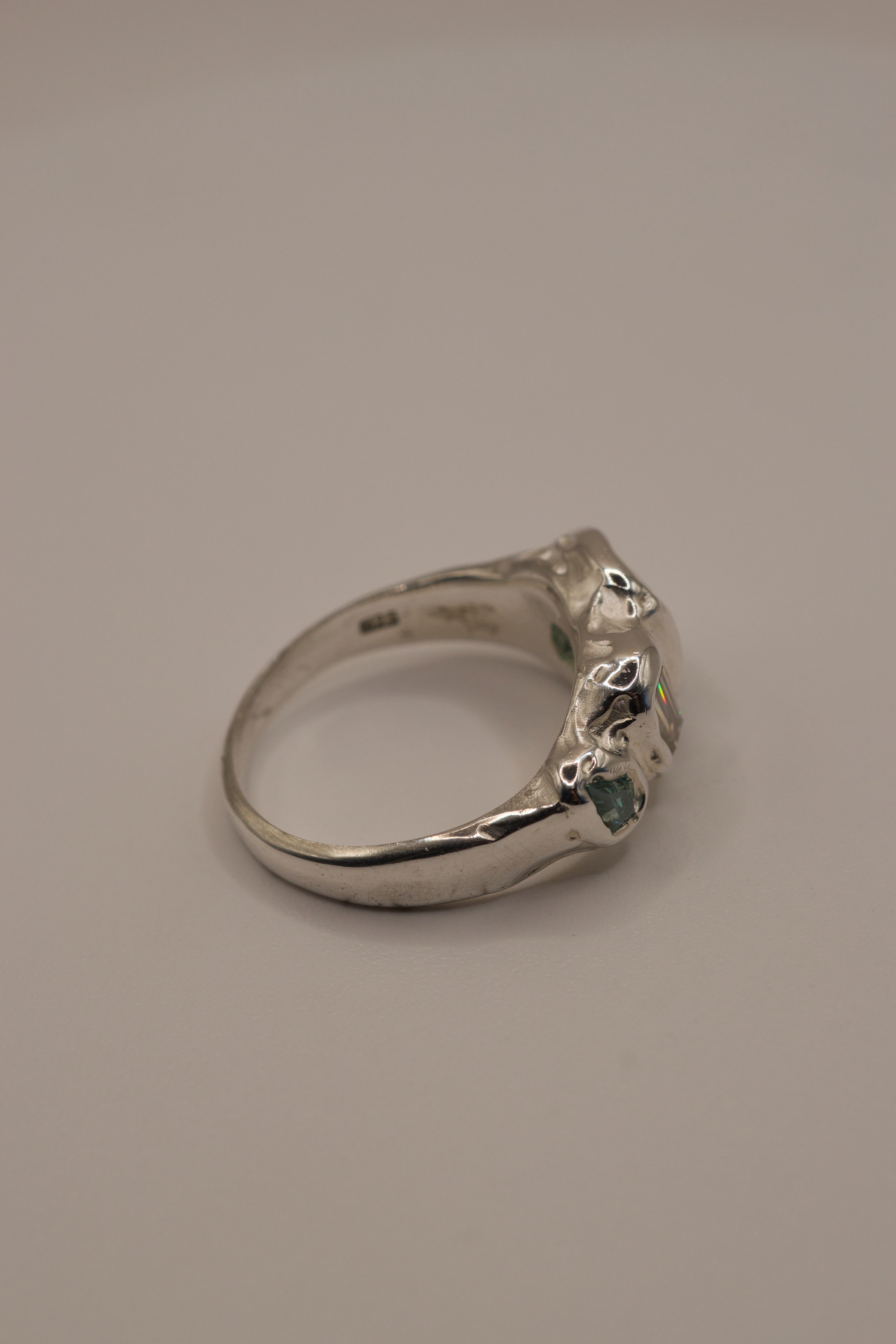 Front view of the Seafoam Siren Ring showing aqua tourmaline and moissanite within organic flowing recycled sterling silver handmade using lost wax casting