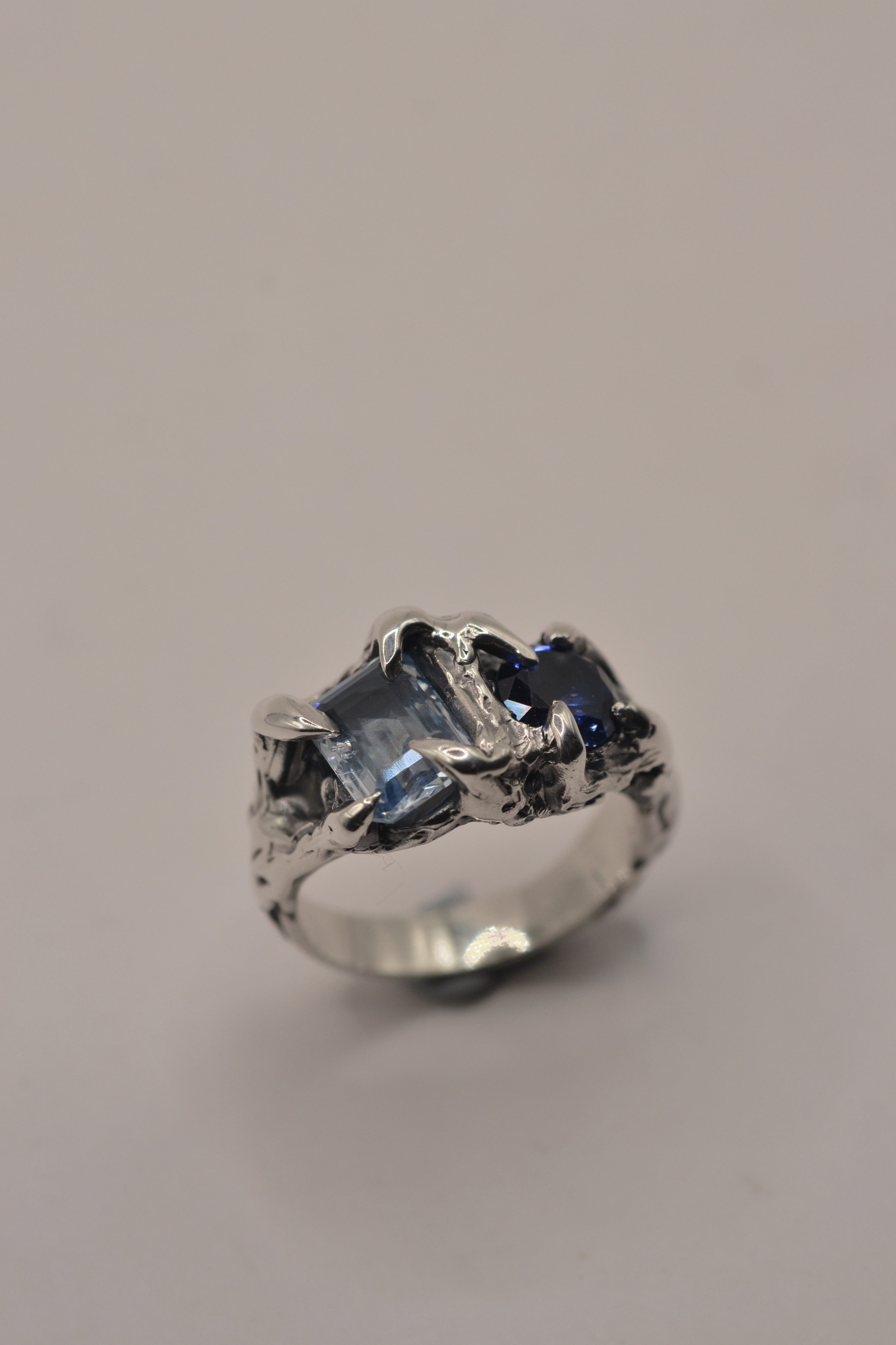 Unique non traditional blue silver ring Something Blue design lost wax cast in darkened sterling silver with natural blue sapphire