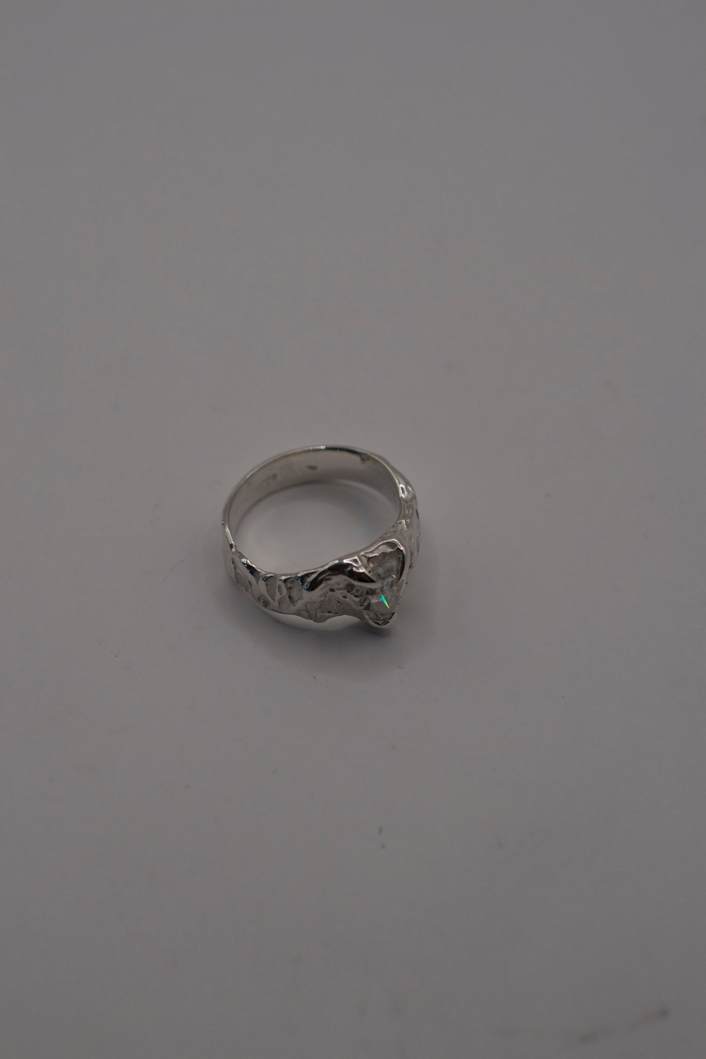 sterling silver ring with molten texture and coffin moissanite stone