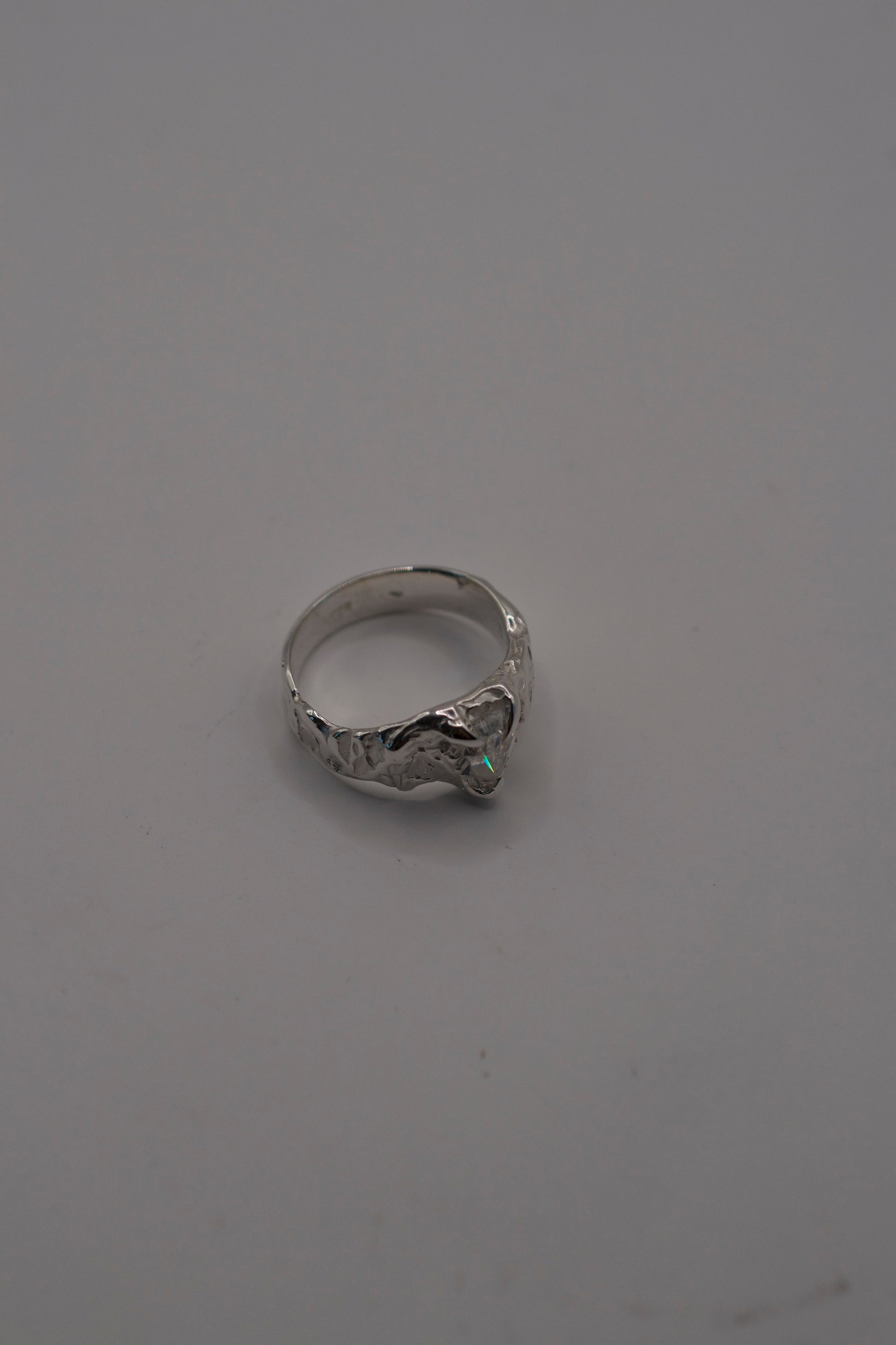 sterling silver ring with molten texture and coffin moissanite stone