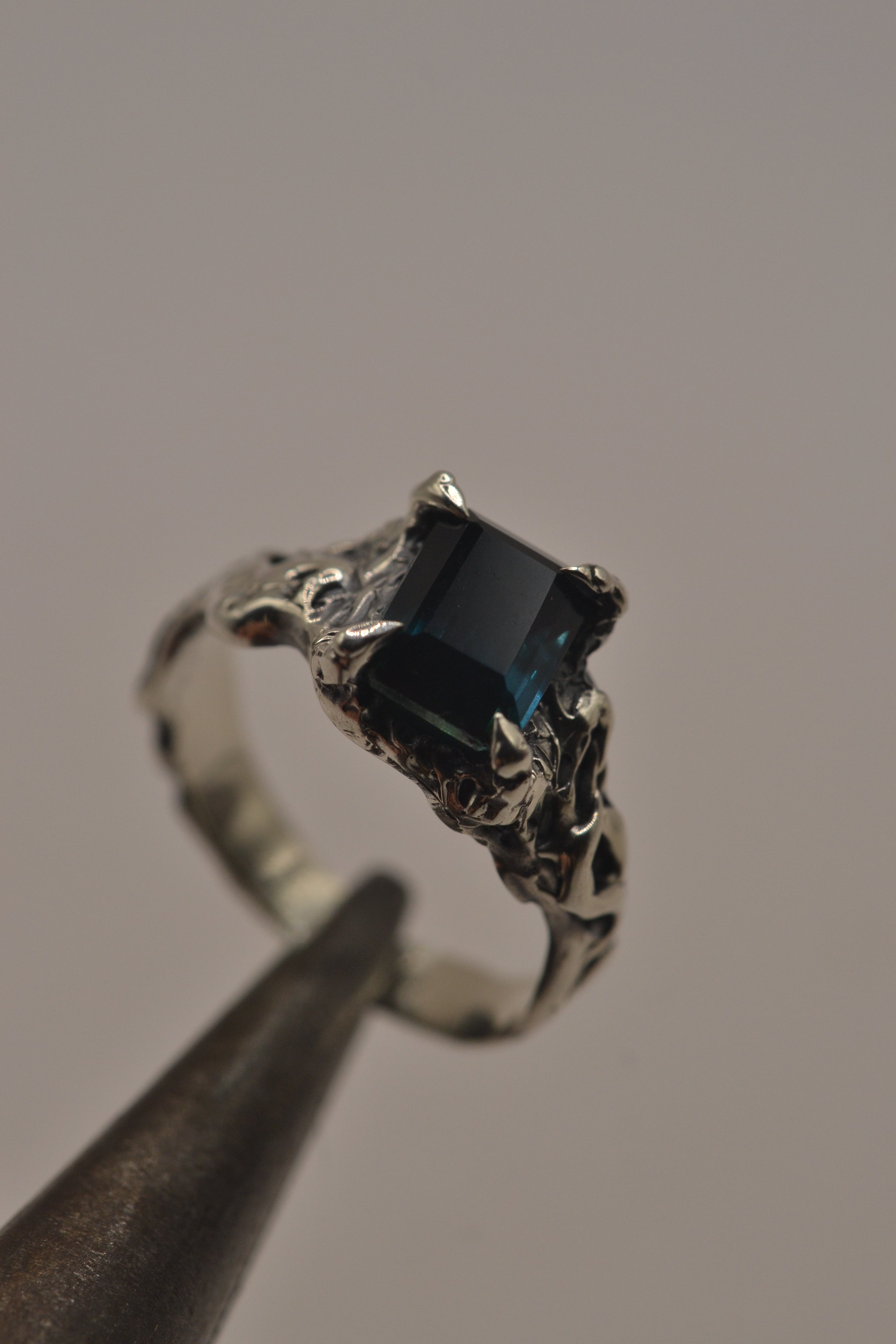 Handmade gothic alternative silver ring Twilight design lost wax cast with teal lab-grown sapphire in darkened textured sterling silver