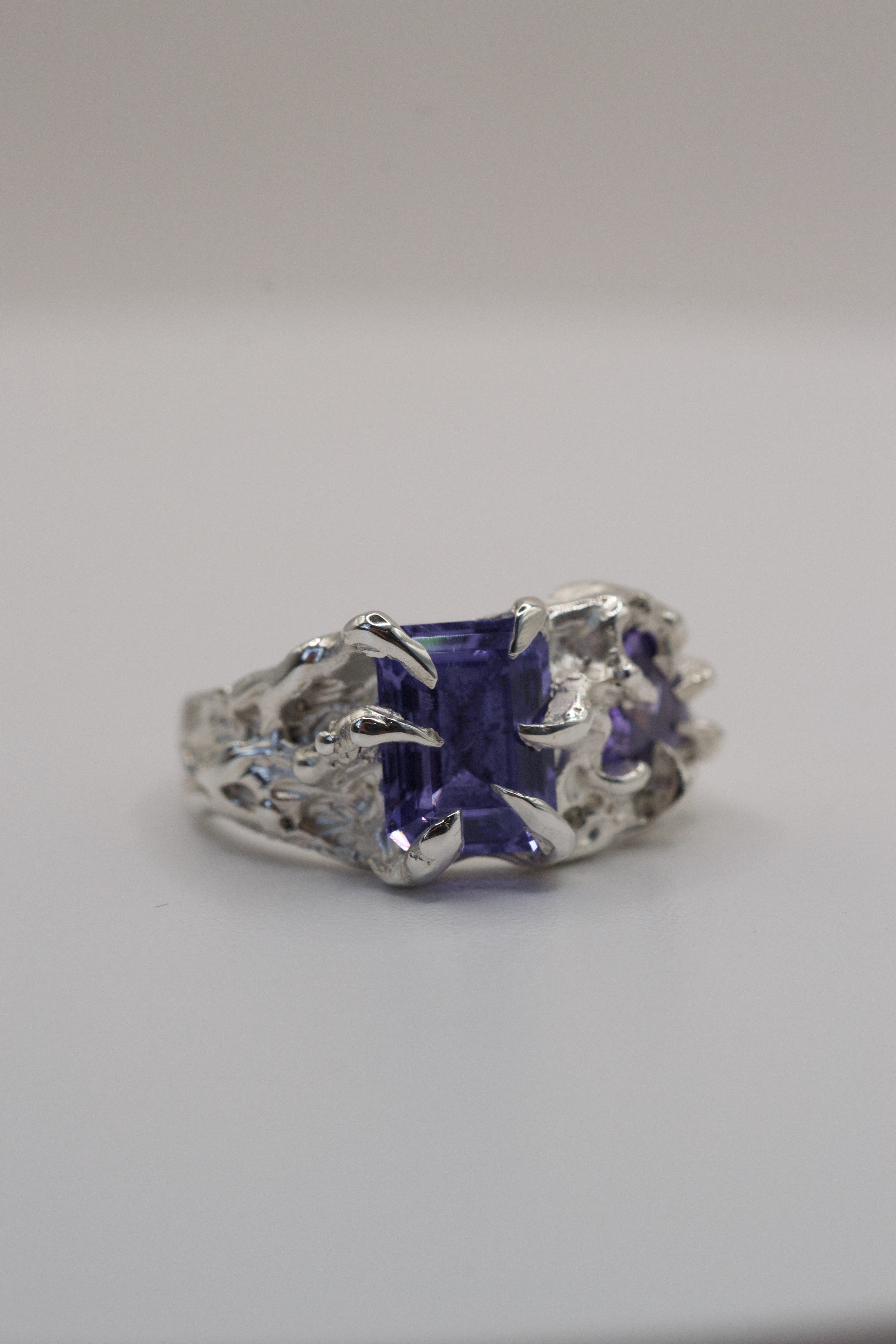Another angle of the Wilted Ring showing purple tourmaline and heart cubic zirconia within sharp gothic sterling silver claws lost wax cast